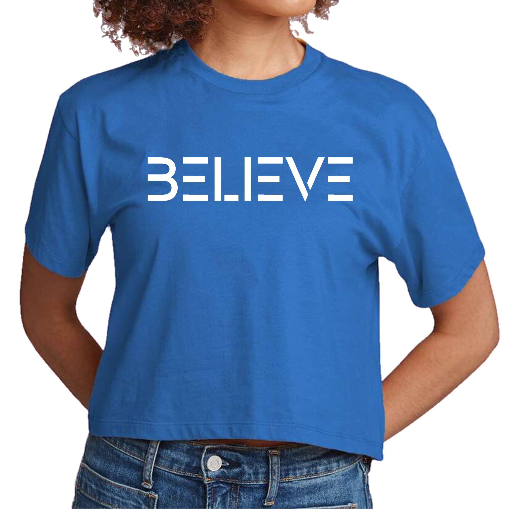 Women's cropped graphic t-shirt in white featuring an inspirational 'Believe' print, made from soft preshrunk cotton.