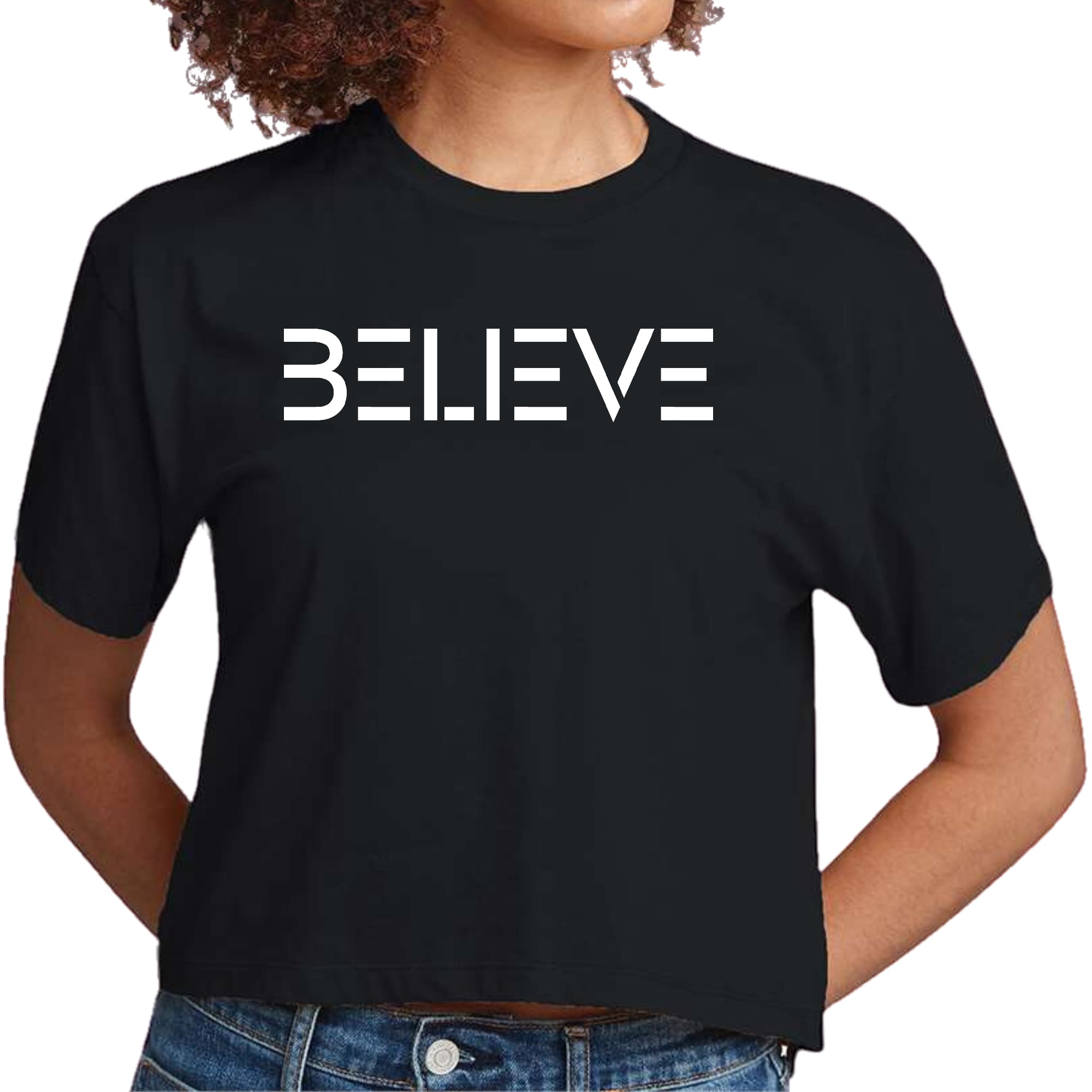 Women's cropped graphic t-shirt in white featuring an inspirational 'Believe' print, made from soft preshrunk cotton.