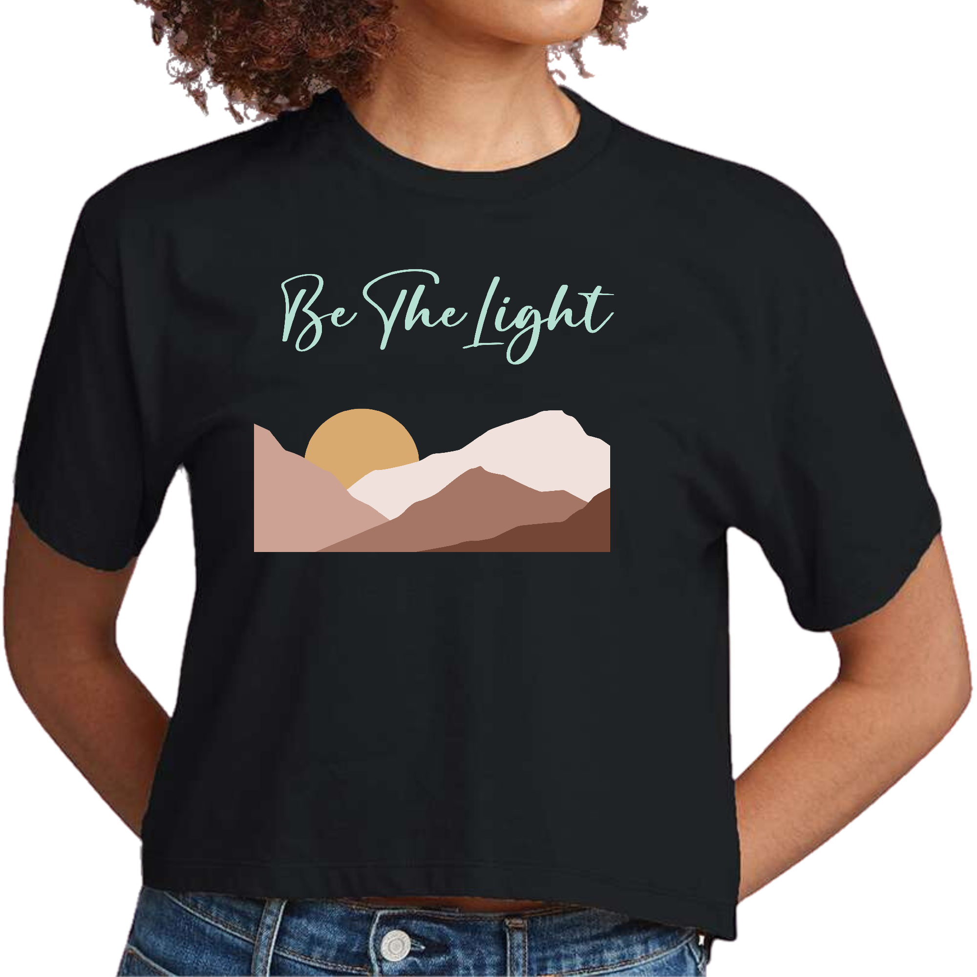 Womens Cropped Graphic T-shirt featuring a vibrant 'Be the Light' illustration, showcasing a creative and stylish design.