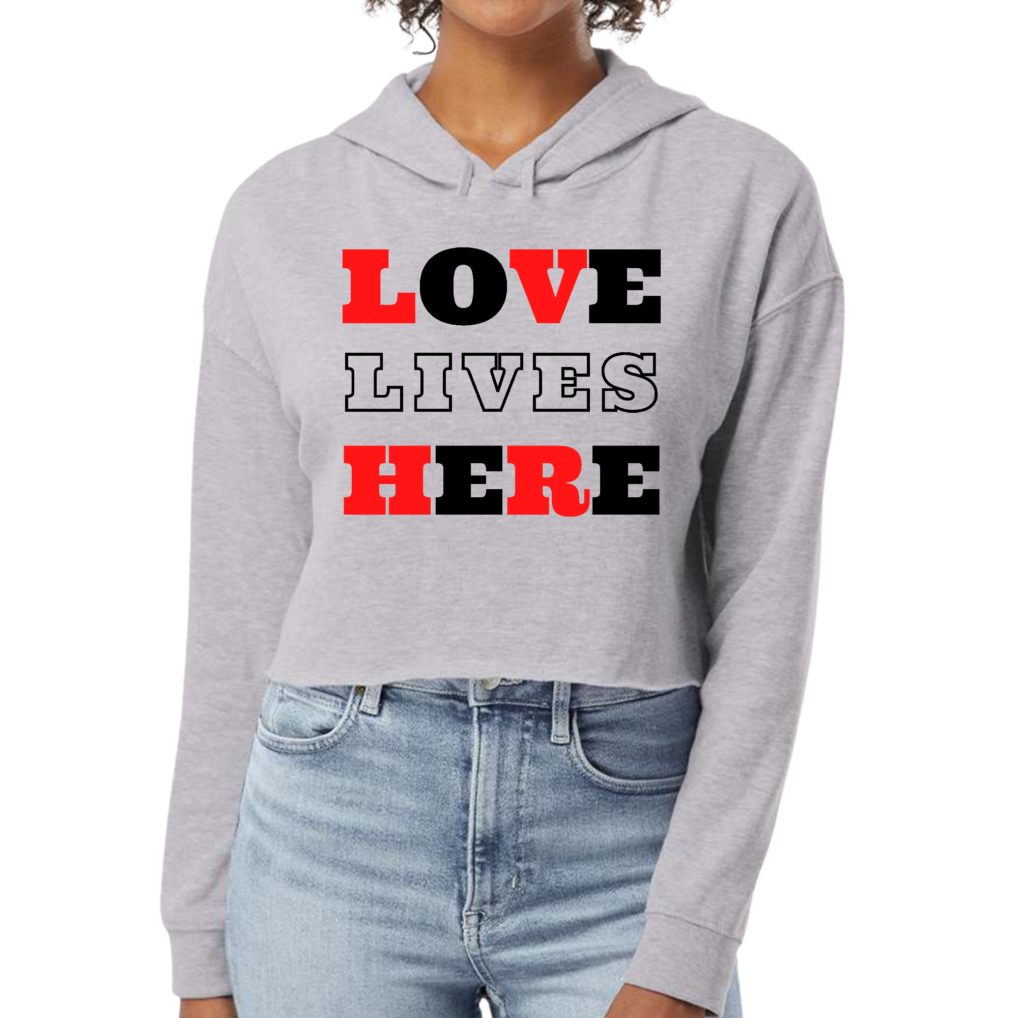 Women's cropped hoodie in red and black with Christian 'Love Lives Here' illustration, showcasing a stylish and comfortable design.