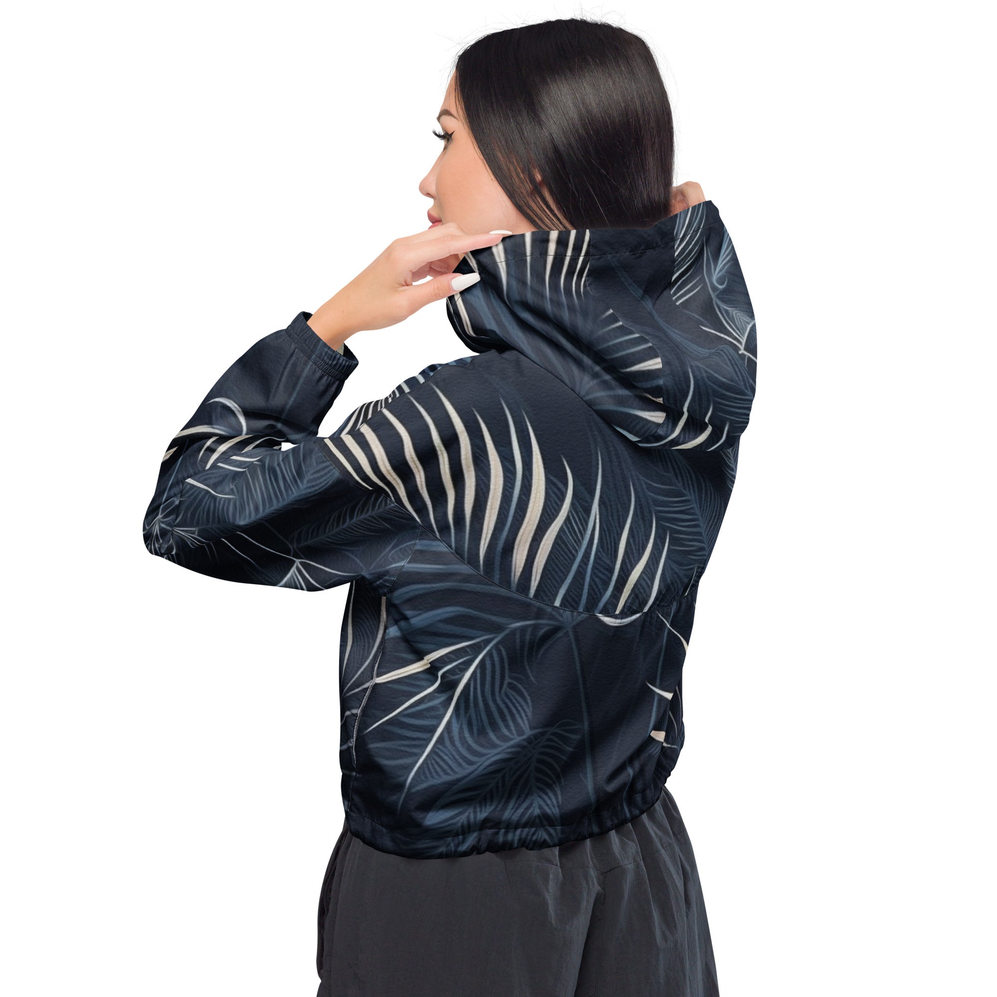 Women's Cropped Windbreaker Jacket in blue and white with palm leaves design, featuring a hood, adjustable drawstrings, and side-slit pockets.