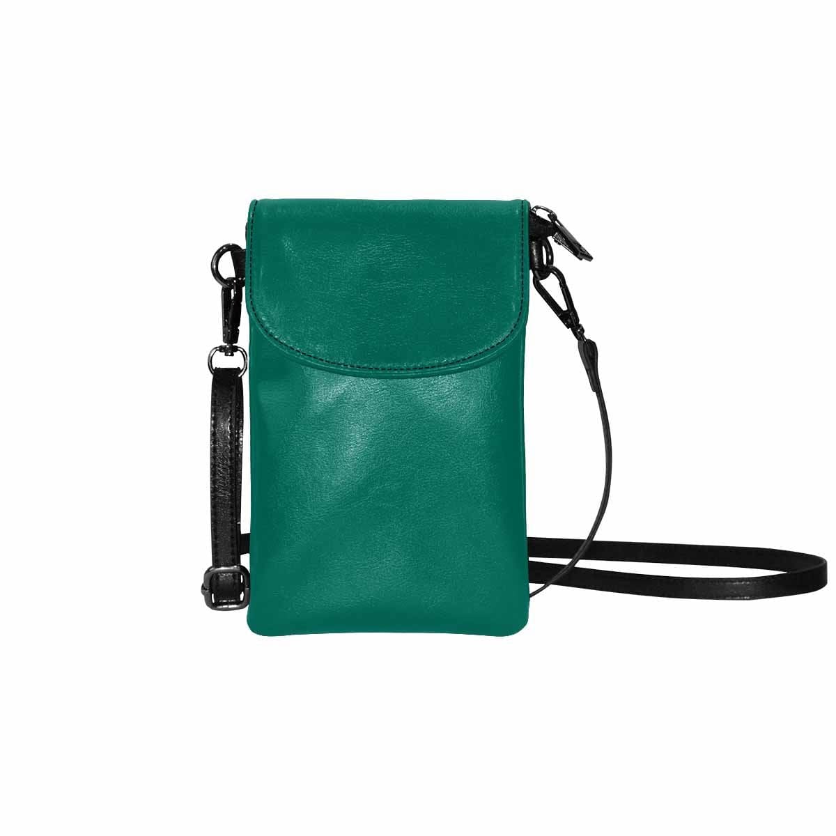 Teal green women's crossbody bag made of PU leather with adjustable strap and zippered pockets.