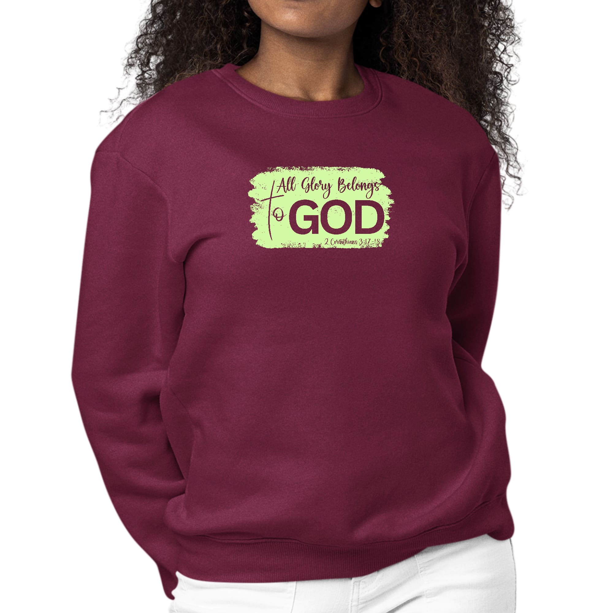 Women's long sleeve graphic sweatshirt in neon with 'All Glory Belongs to God' illustration, showcasing comfort and style.