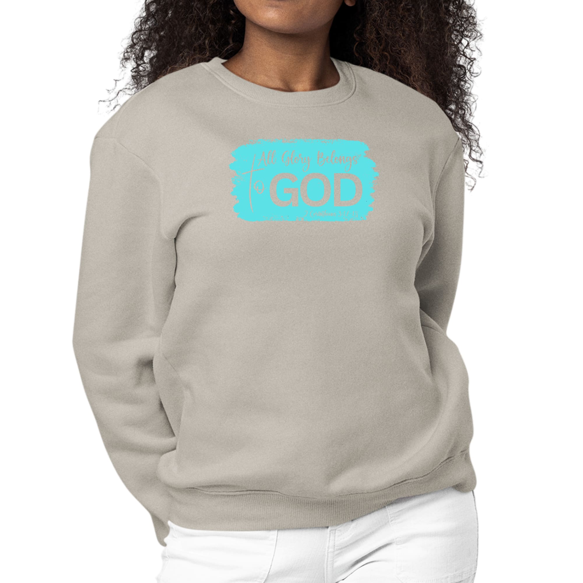 Women's long sleeve crewneck sweatshirt with 'All Glory Belongs to God' graphic in cyan, showcasing comfort and style.