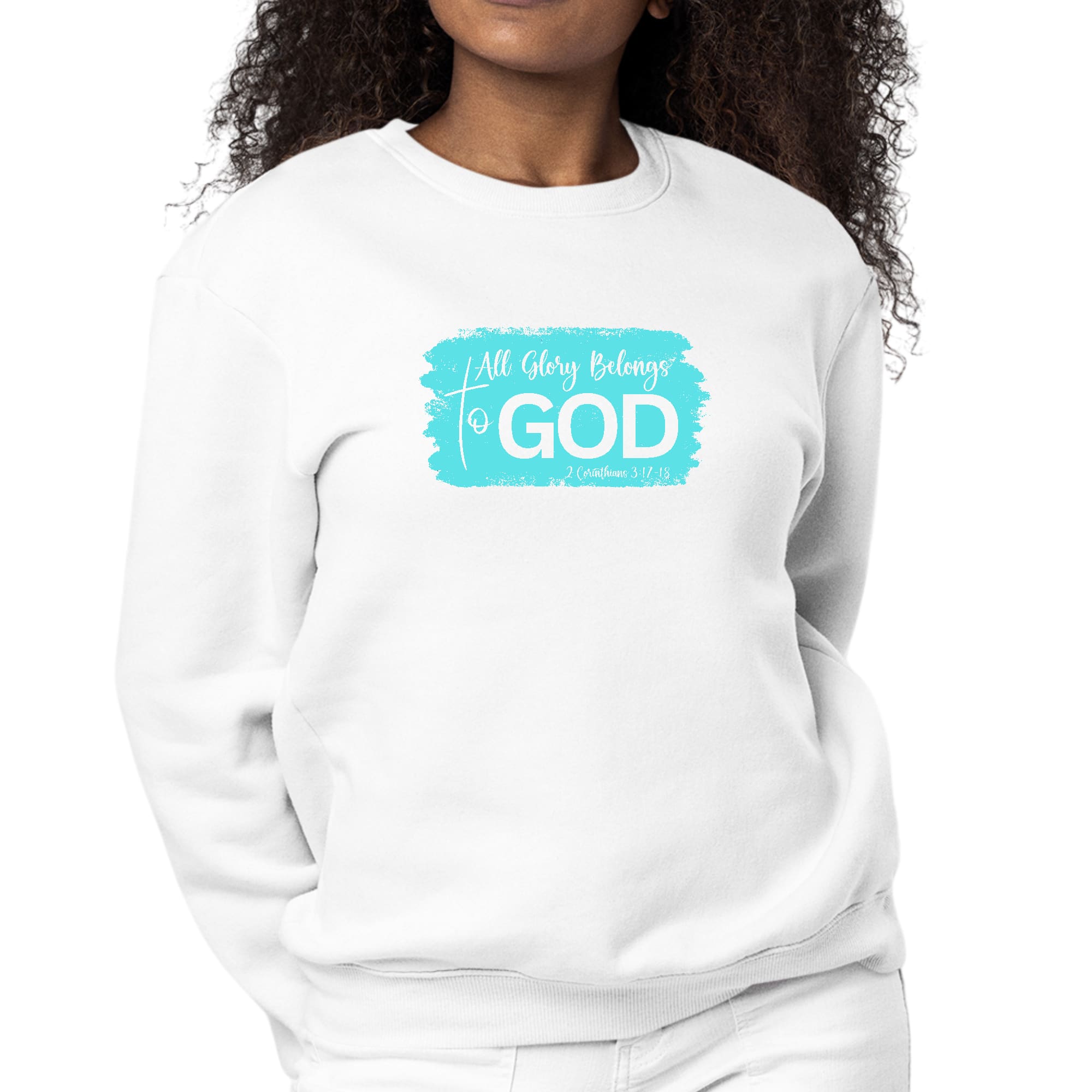 Women's long sleeve crewneck sweatshirt with 'All Glory Belongs to God' graphic in cyan, showcasing comfort and style.