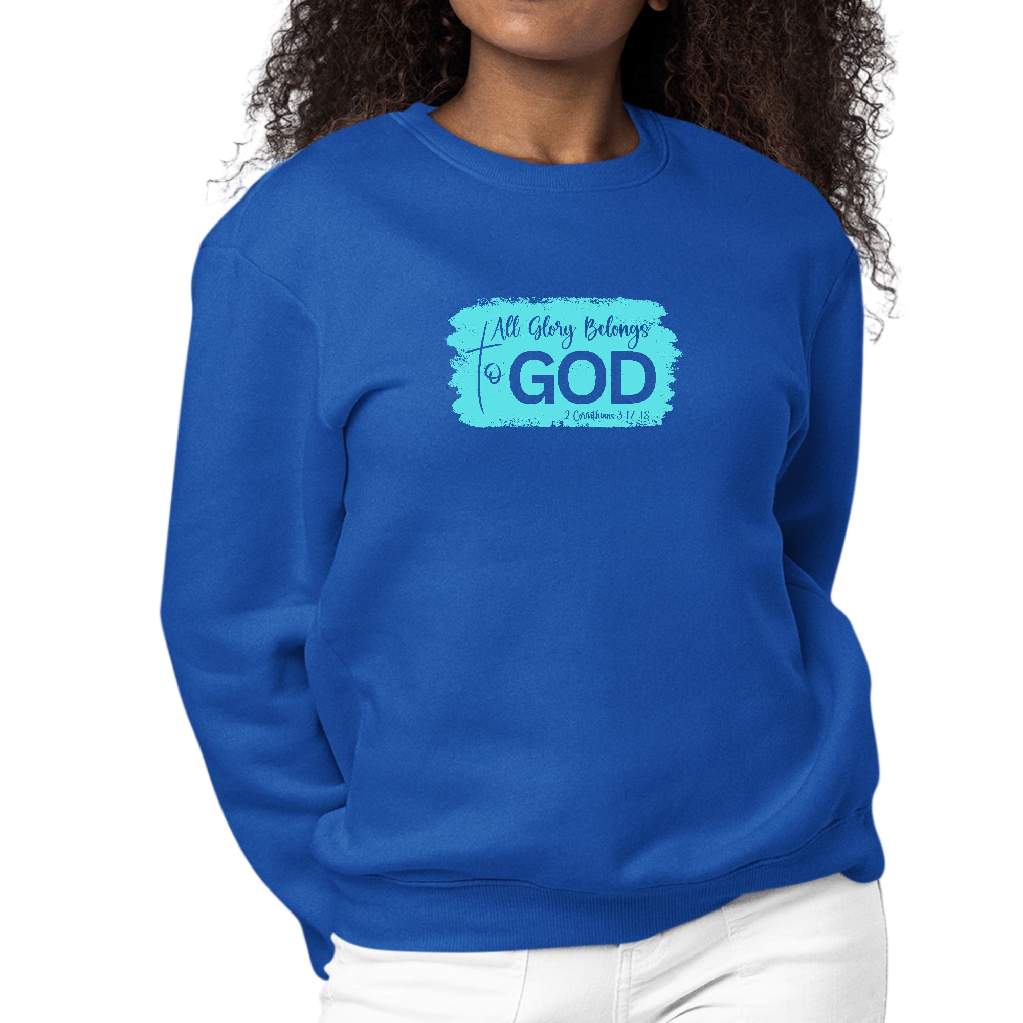 Women's long sleeve crewneck sweatshirt with 'All Glory Belongs to God' graphic in cyan, showcasing comfort and style.