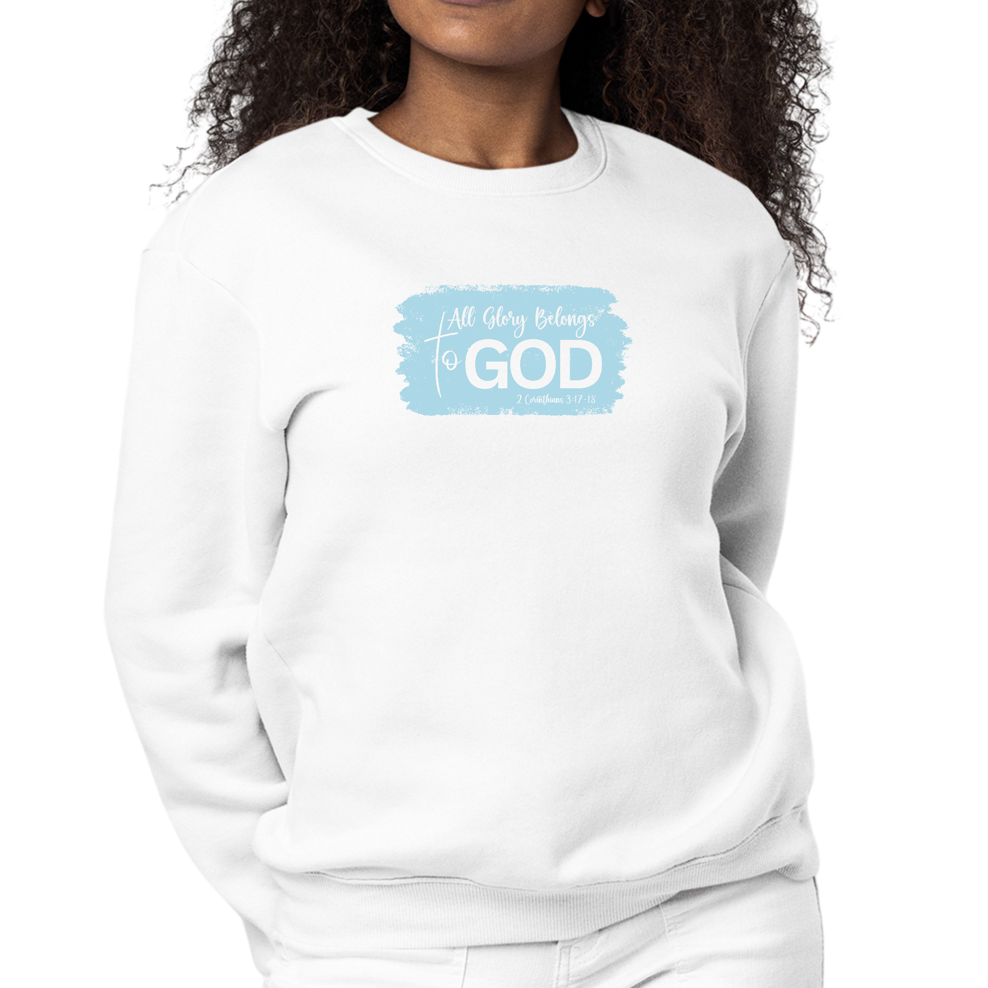 Light blue women's graphic sweatshirt with 'All Glory Belongs to God' illustration, featuring a classic crewneck and cozy fleece material.