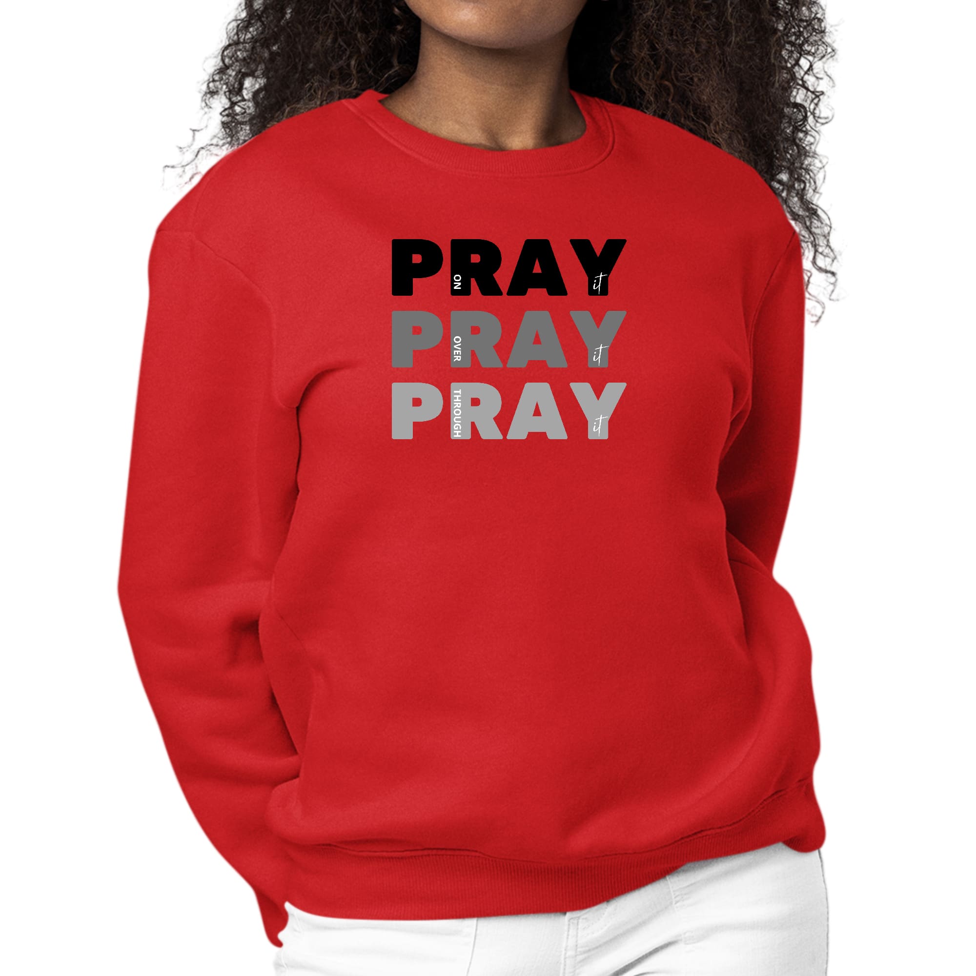 Women's black graphic sweatshirt with 'Pray On It Over It Through It' print, featuring long sleeves and a crewneck design.