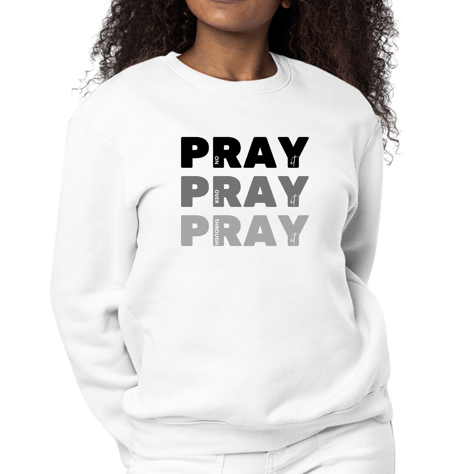 Women's black graphic sweatshirt with 'Pray On It Over It Through It' print, featuring long sleeves and a crewneck design.