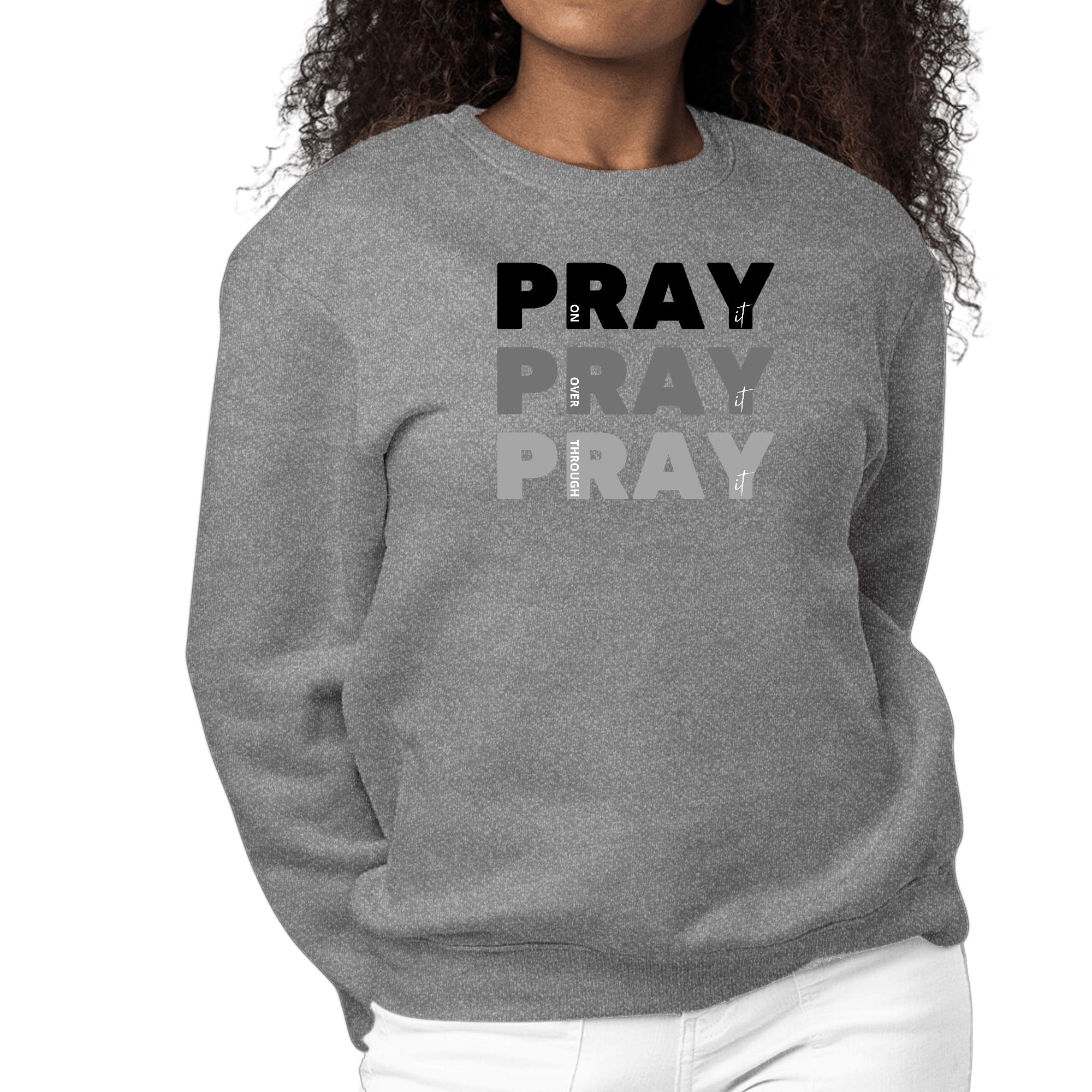 Women's black graphic sweatshirt with 'Pray On It Over It Through It' print, featuring long sleeves and a crewneck design.