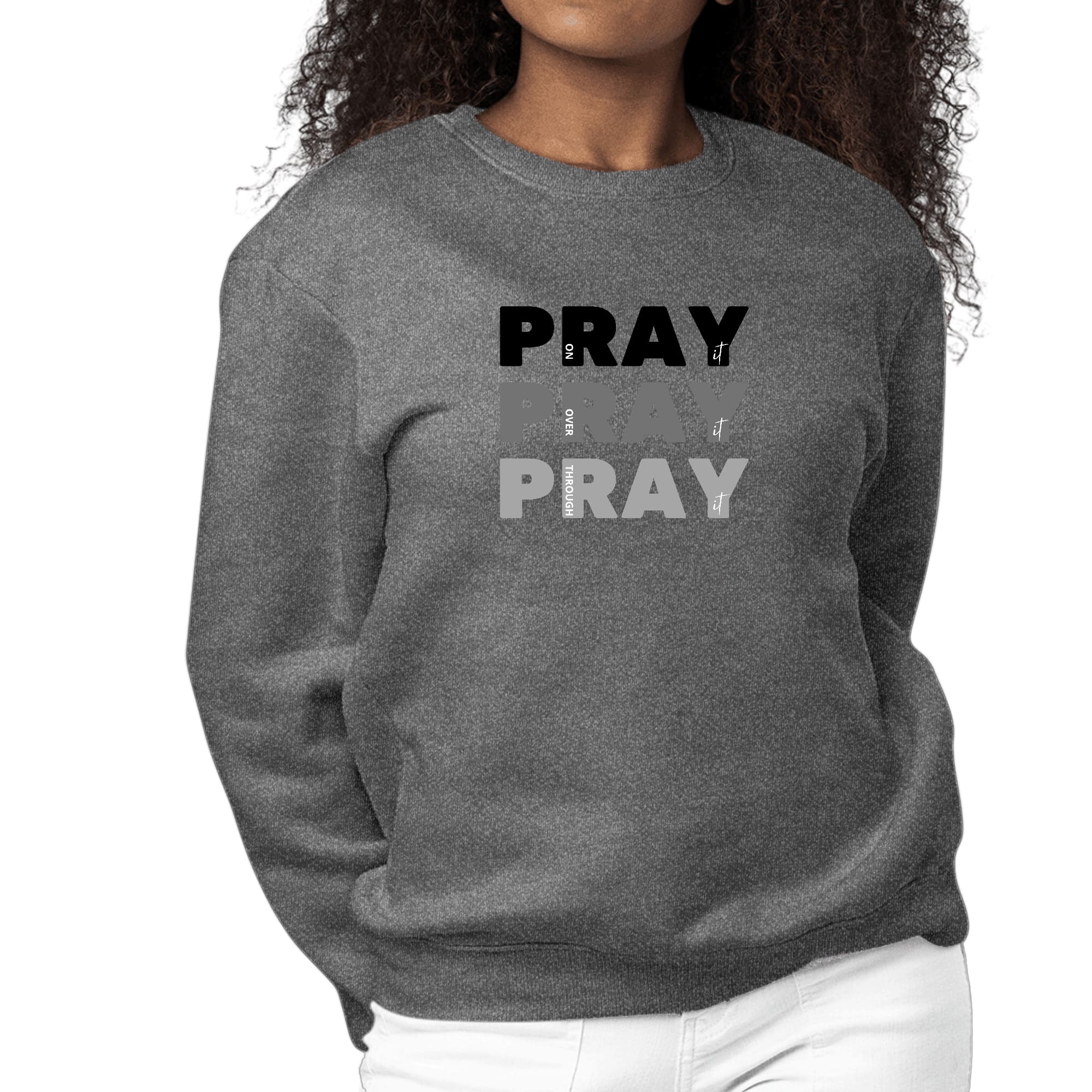 Women's black graphic sweatshirt with 'Pray On It Over It Through It' print, featuring long sleeves and a crewneck design.