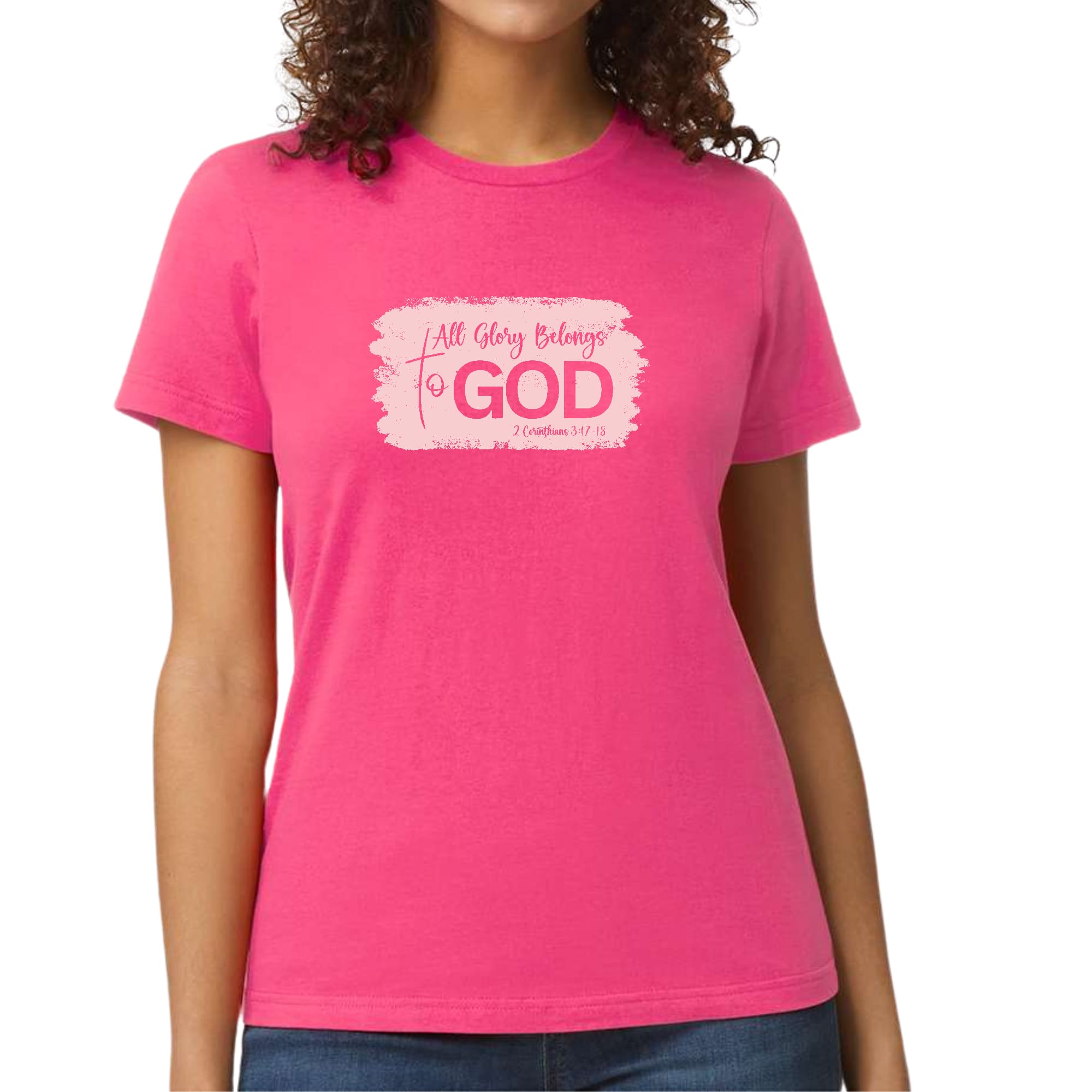 Light pink Women's Graphic T-shirt featuring 'All Glory Belongs to God' design, showcasing a modern and artistic style.