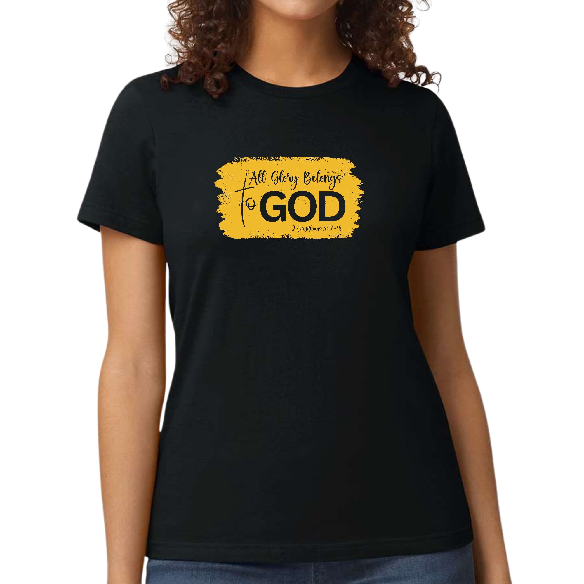 Women's golden yellow graphic t-shirt with 'All Glory Belongs to God' design, showcasing a modern and stylish look.