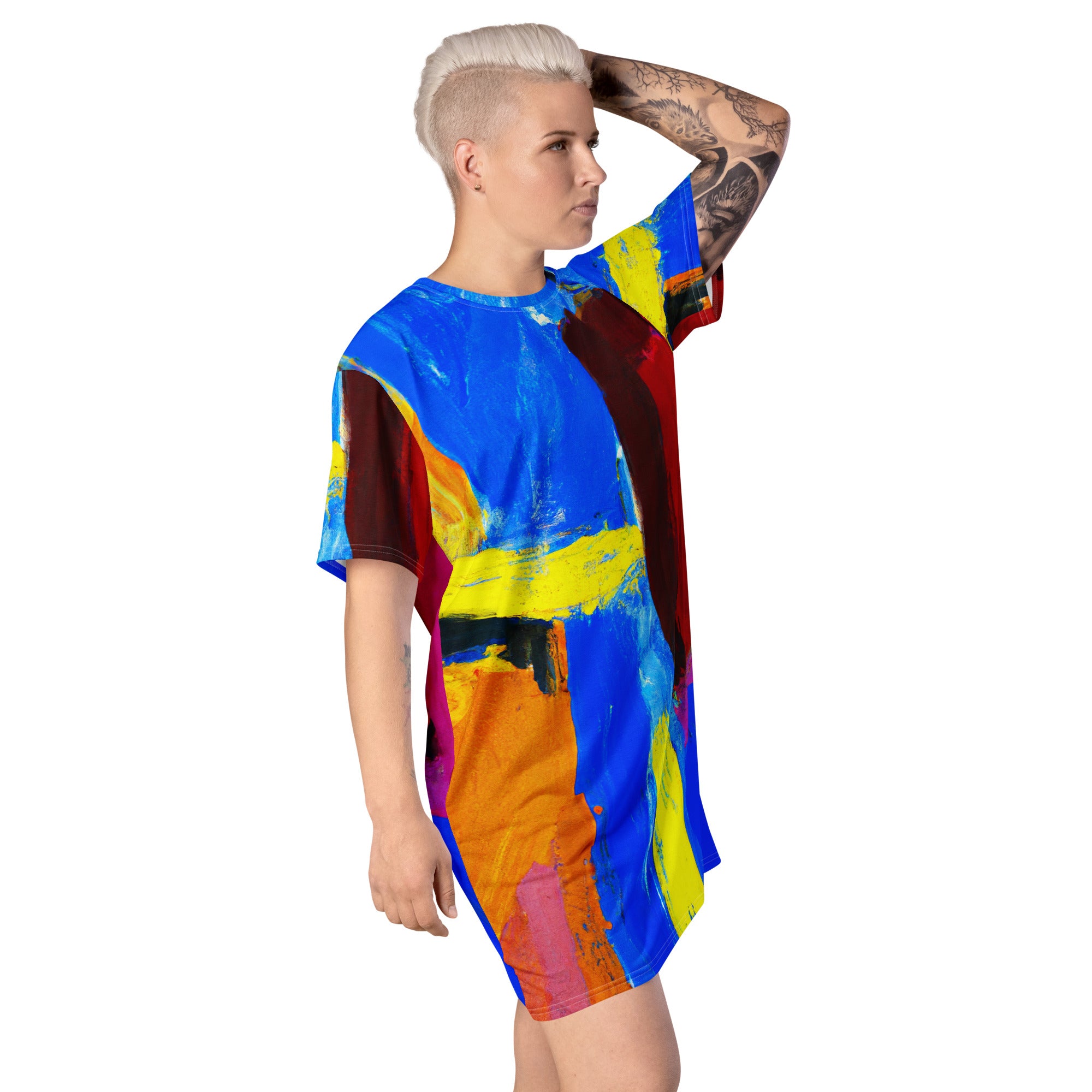 Womens Graphic T-shirt Dress featuring a vibrant blue and red abstract pattern, showcasing its oversized fit and stylish design.