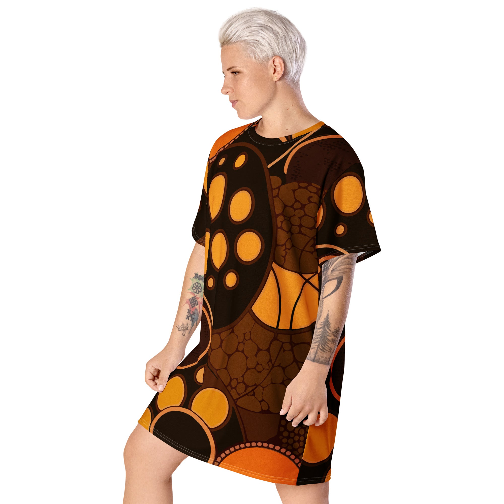 Womens Graphic T-shirt Dress featuring an orange and brown spotted print, showcasing its oversized fit and stylish design.