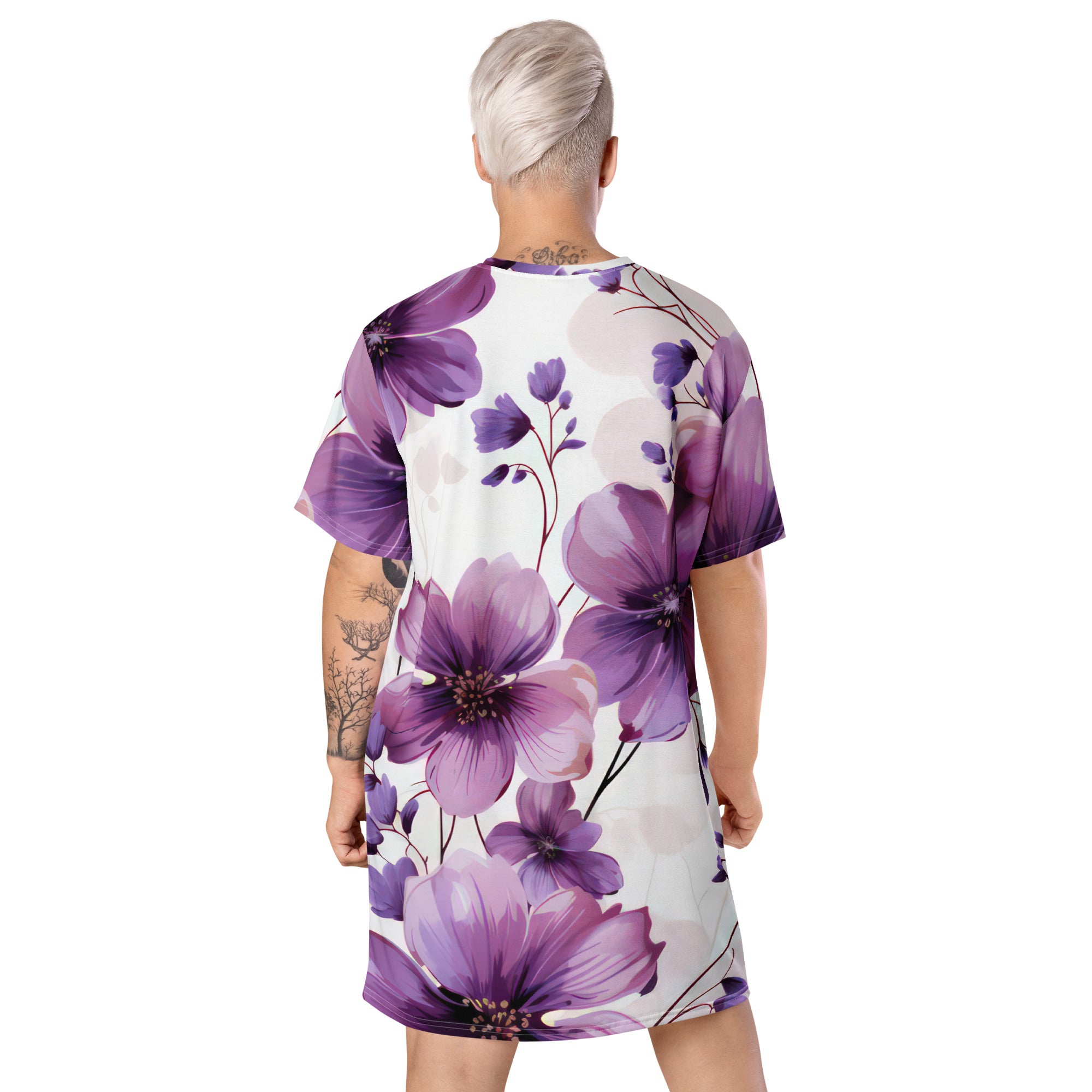 Womens Graphic T-shirt Dress featuring a vibrant purple botanical blooms design, showcasing its oversized fit and stylish look.