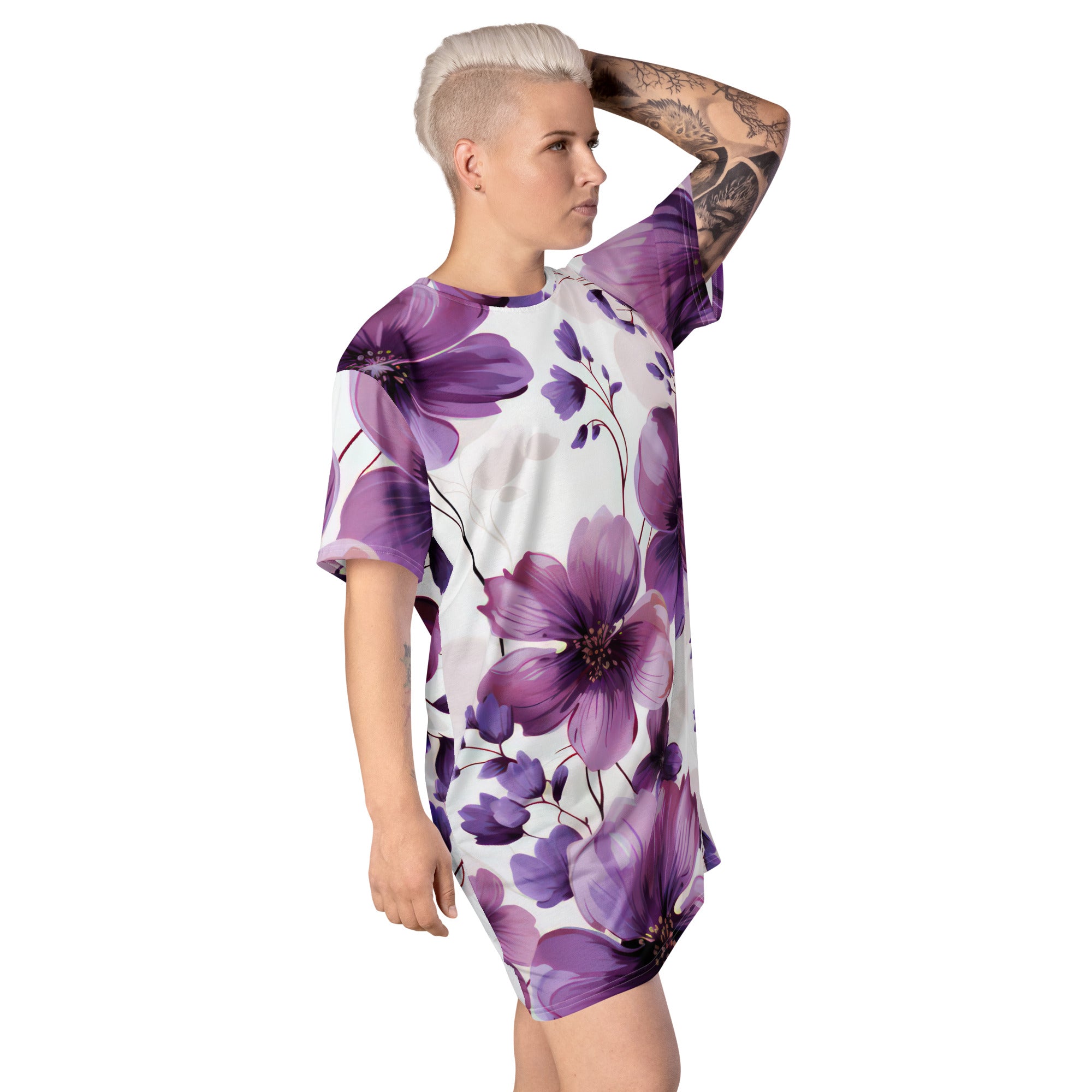 Womens Graphic T-shirt Dress featuring a vibrant purple botanical blooms design, showcasing its oversized fit and stylish look.