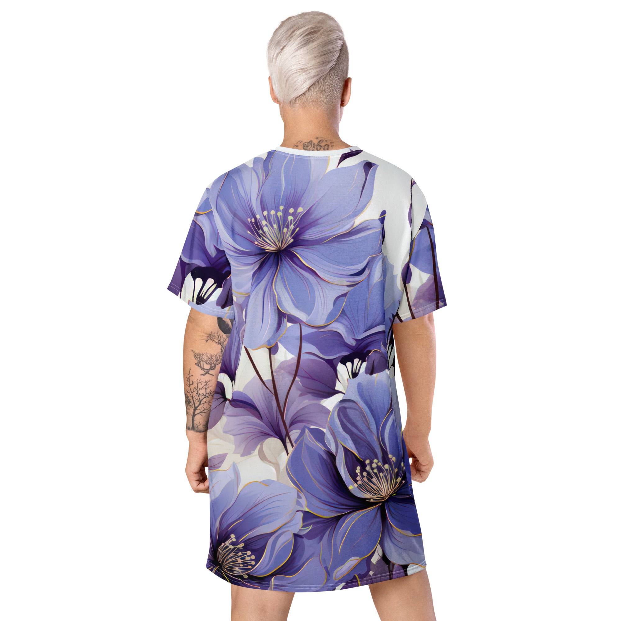 Womens Graphic T-shirt Dress featuring a vibrant purple botanical blooms print, showcasing its oversized fit and stylish design.