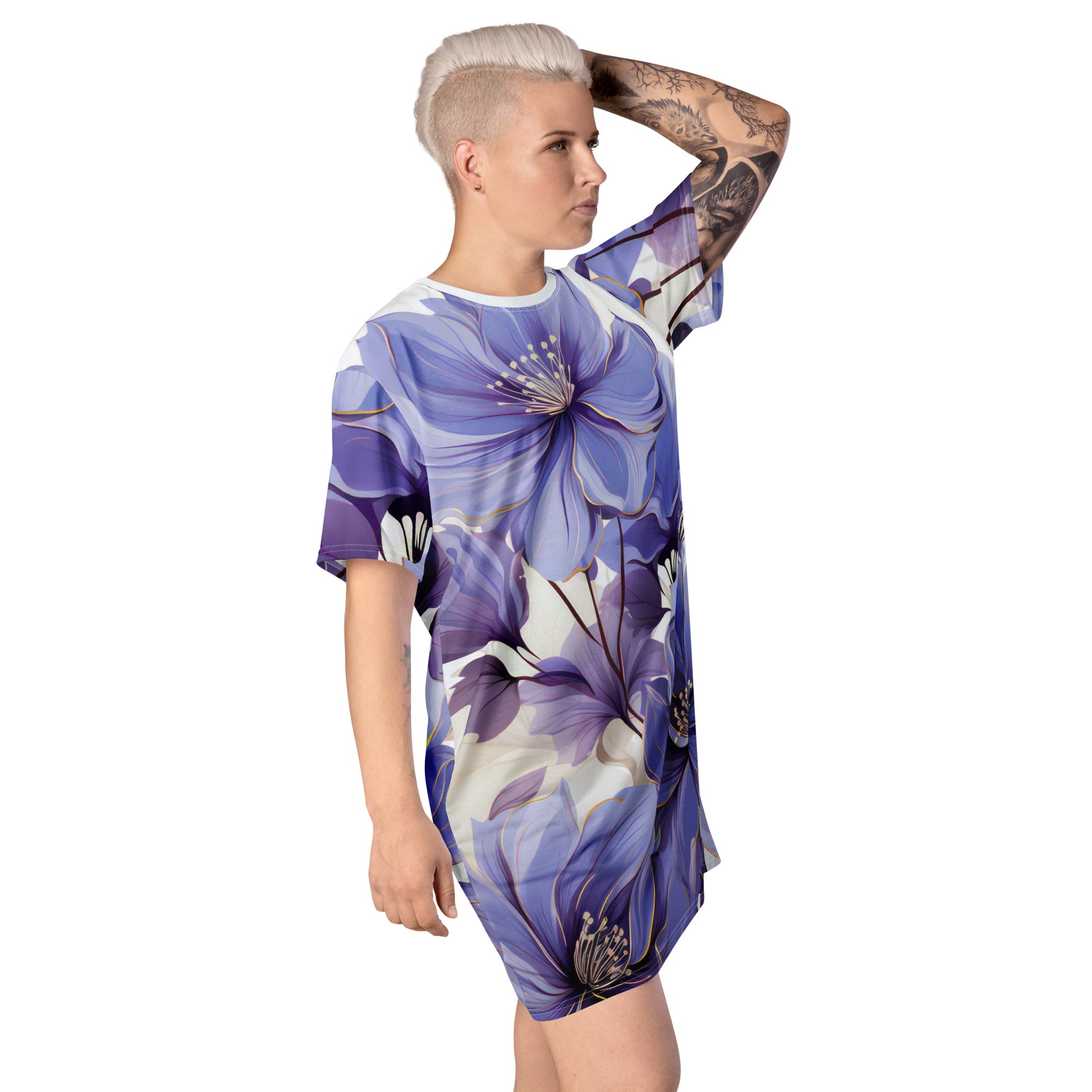 Womens Graphic T-shirt Dress featuring a vibrant purple botanical blooms print, showcasing its oversized fit and stylish design.