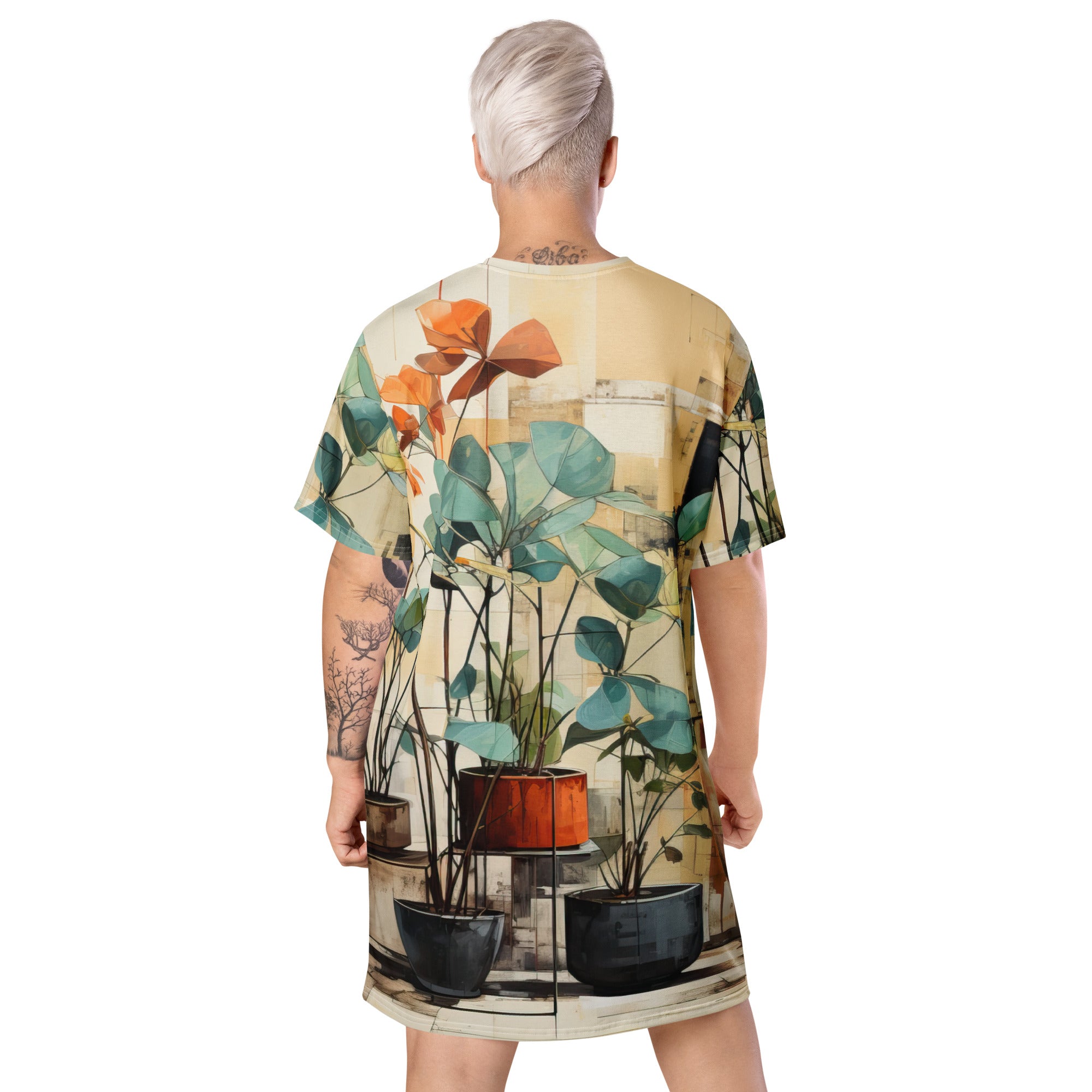 Womens Graphic T-shirt Dress featuring rustic botanical plants design, showcasing its oversized fit and stylish look.