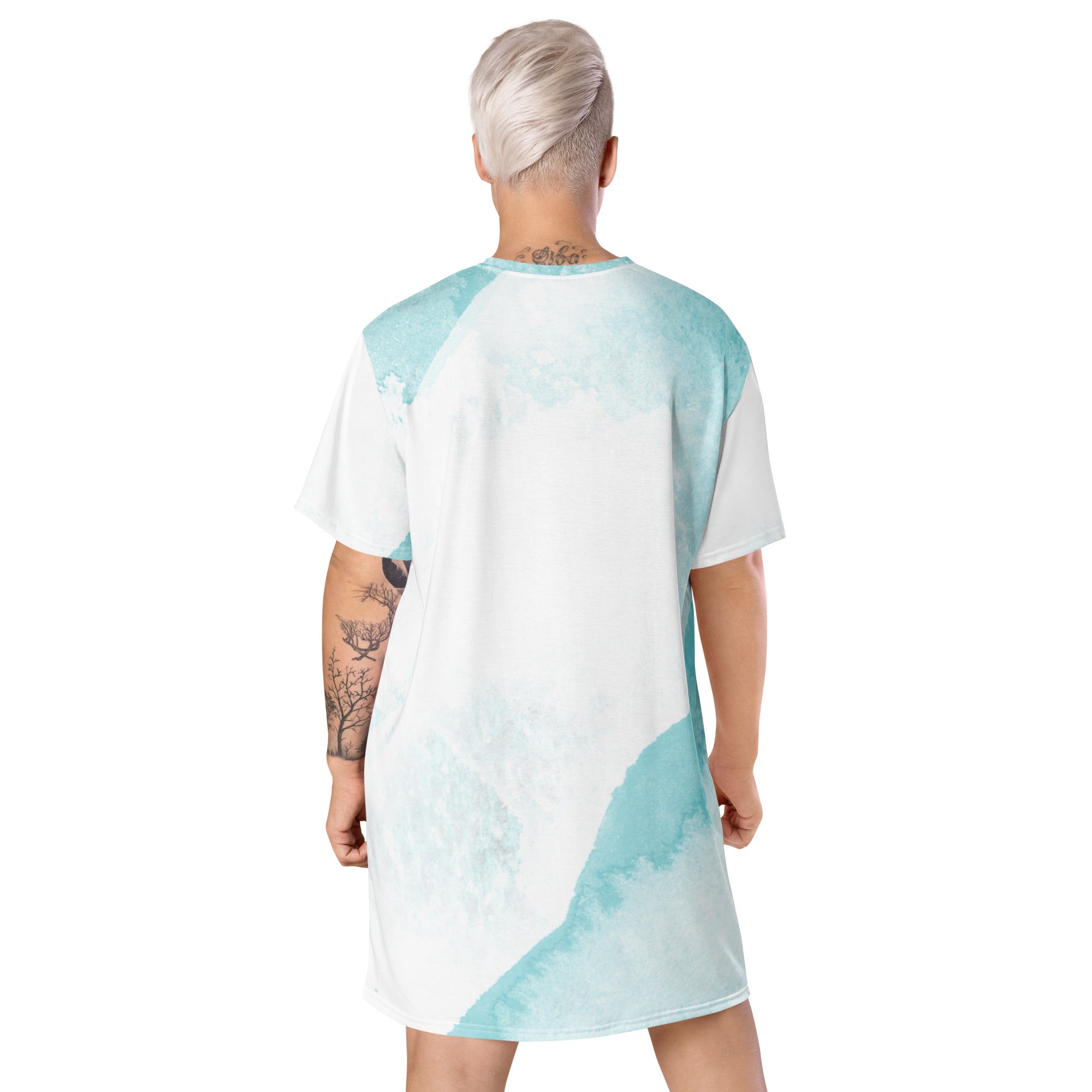 Womens Graphic T-shirt Dress featuring a subtle abstract ocean blue and white print, showcasing its comfortable oversized fit and stylish design.