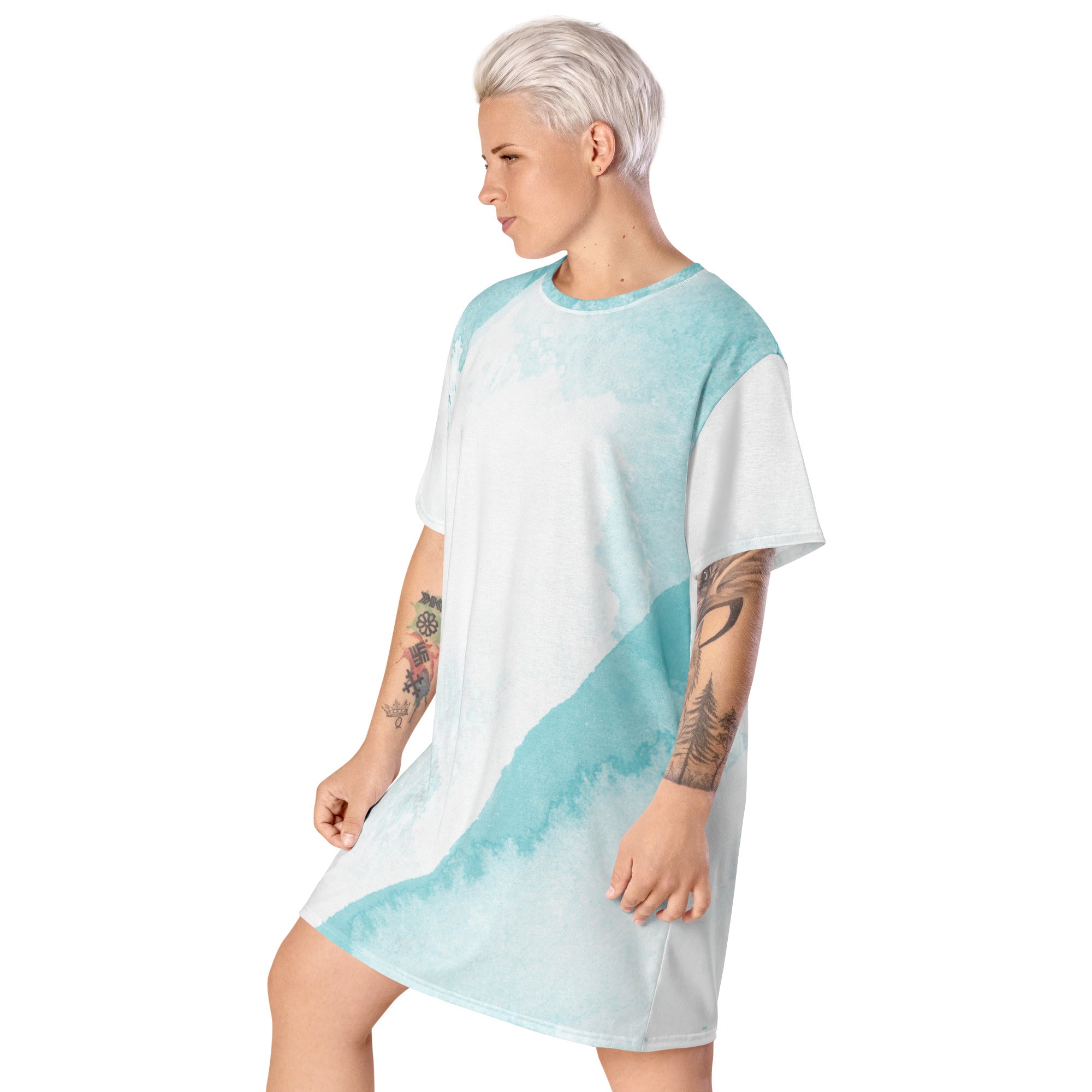 Womens Graphic T-shirt Dress featuring a subtle abstract ocean blue and white print, showcasing its comfortable oversized fit and stylish design.