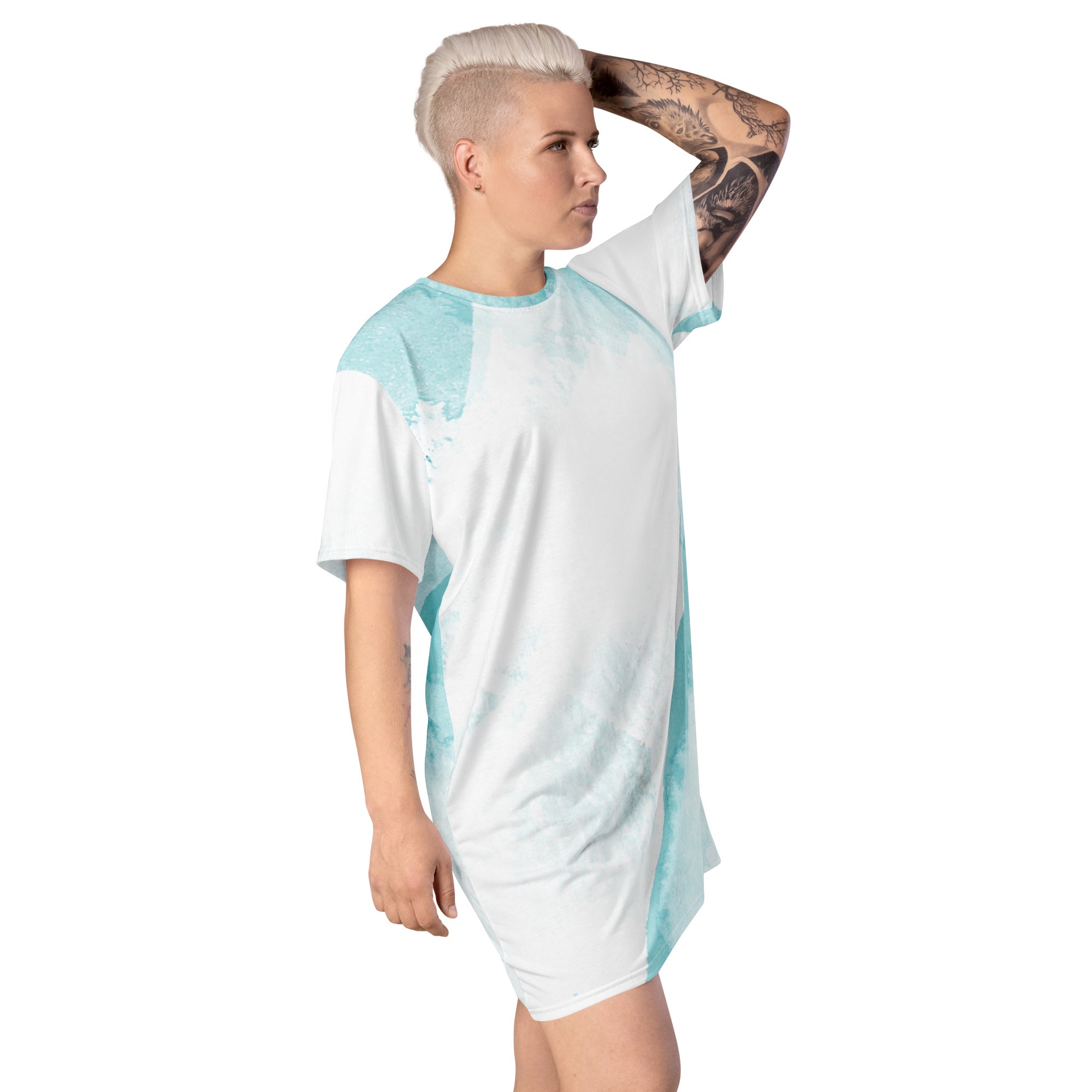 Womens Graphic T-shirt Dress featuring a subtle abstract ocean blue and white print, showcasing its comfortable oversized fit and stylish design.