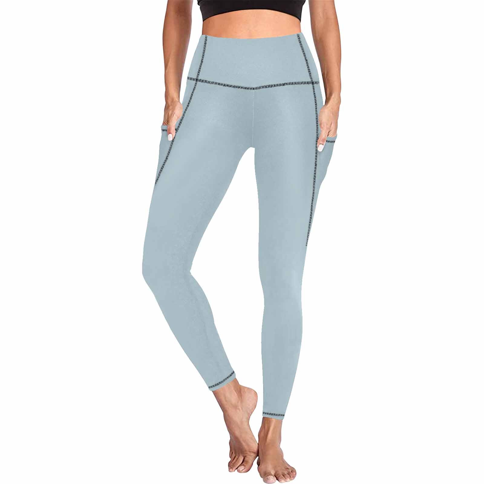 Pastel blue women's leggings with side pockets, designed for fitness and comfort.