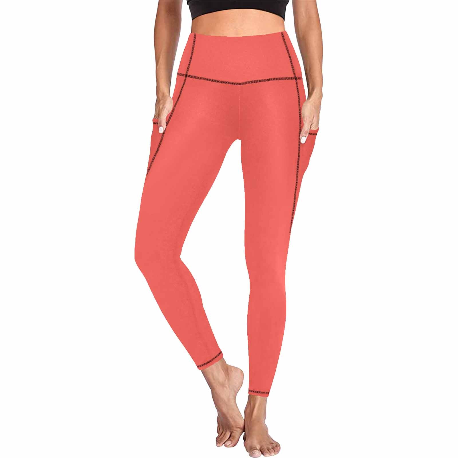 A pair of women's red orange leggings with side pockets, showcasing a stylish and comfortable design for fitness activities.