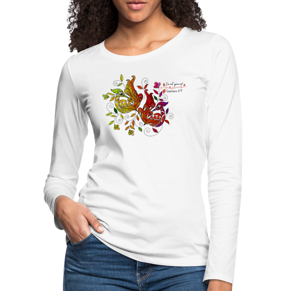 A vibrant women's long sleeve graphic tee featuring a colorful peacock print and affirmations, showcasing its soft cotton fabric and stylish design.