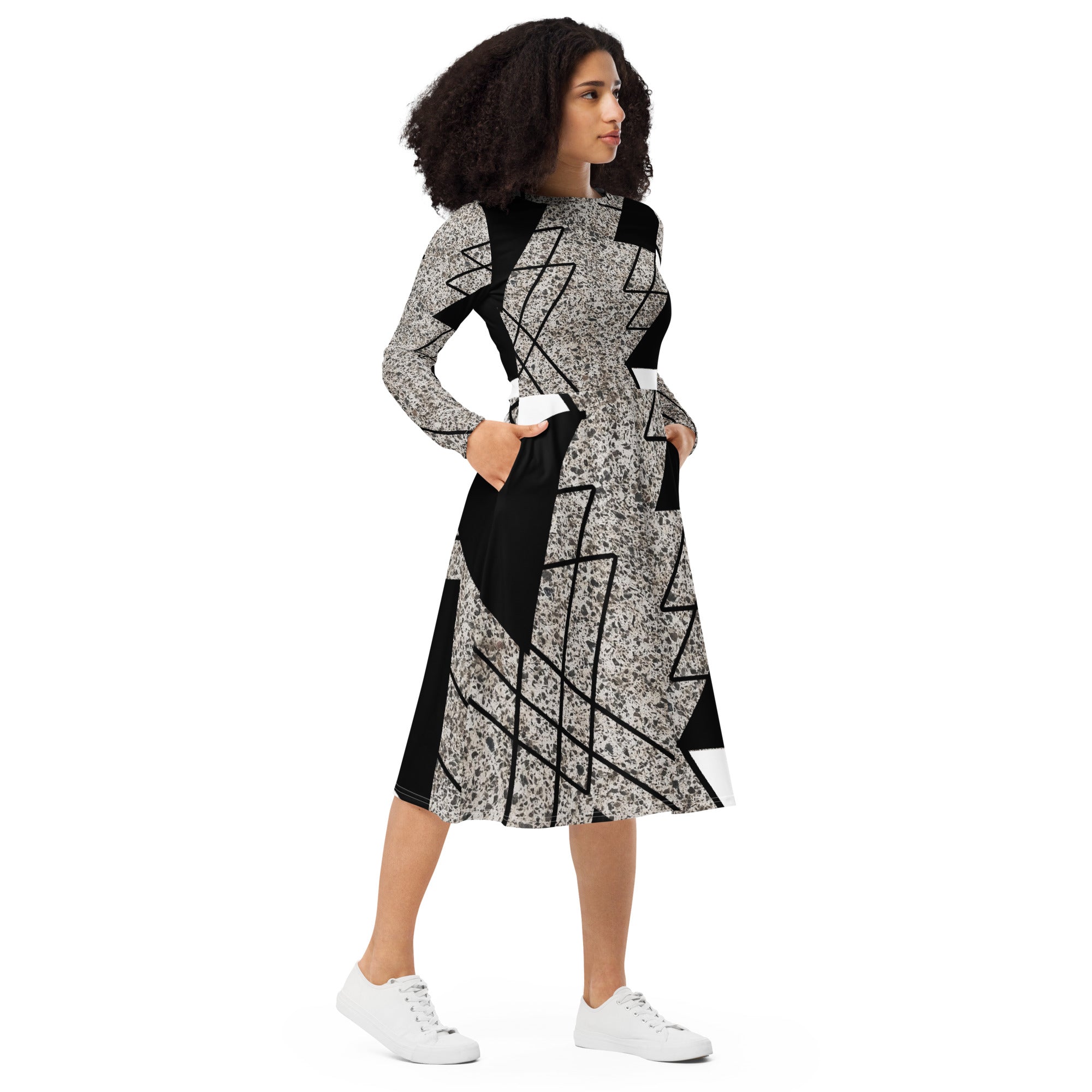 Womens Long Sleeve Midi Dress featuring a black and white triangular colorblock design, showcasing its elegant silhouette and side pockets.