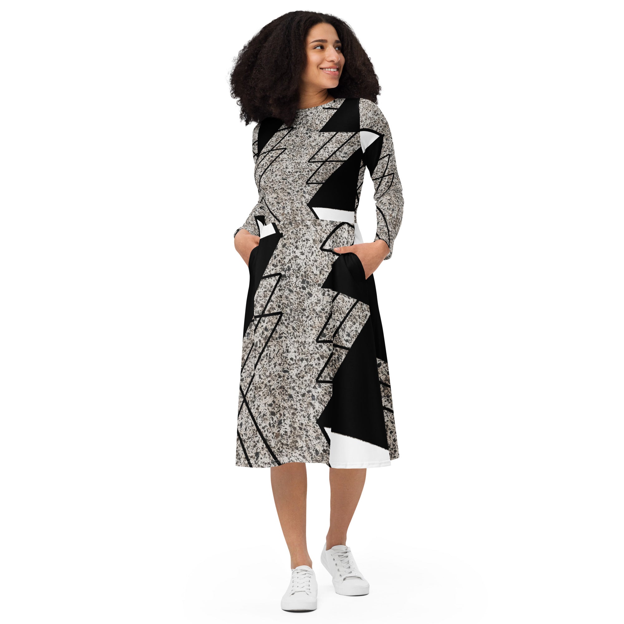 Womens Long Sleeve Midi Dress featuring a black and white triangular colorblock design, showcasing its elegant silhouette and side pockets.