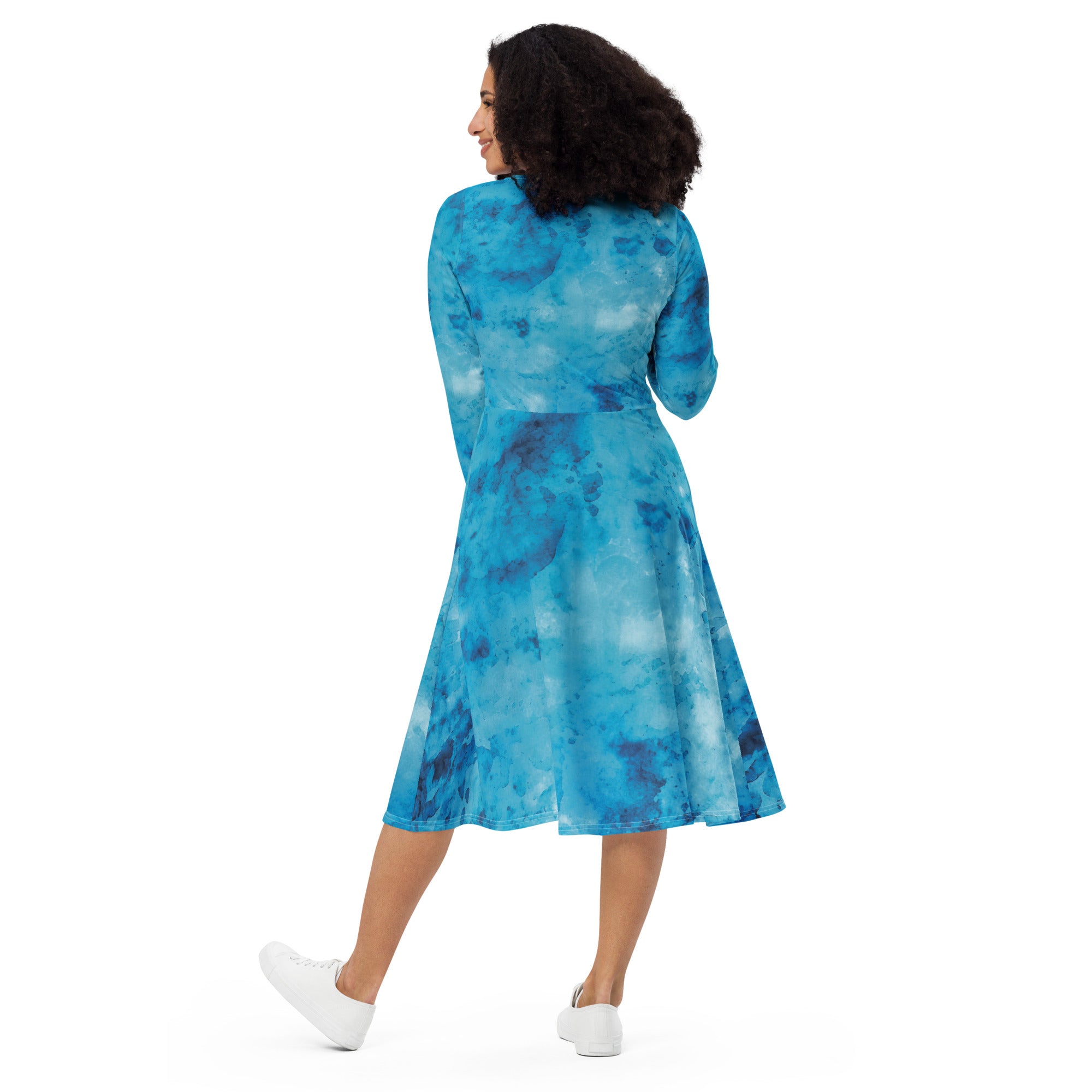 Womens Long Sleeve Midi Dress featuring a blue marble print, showcasing a fitted waist, flared bottom, and side pockets.