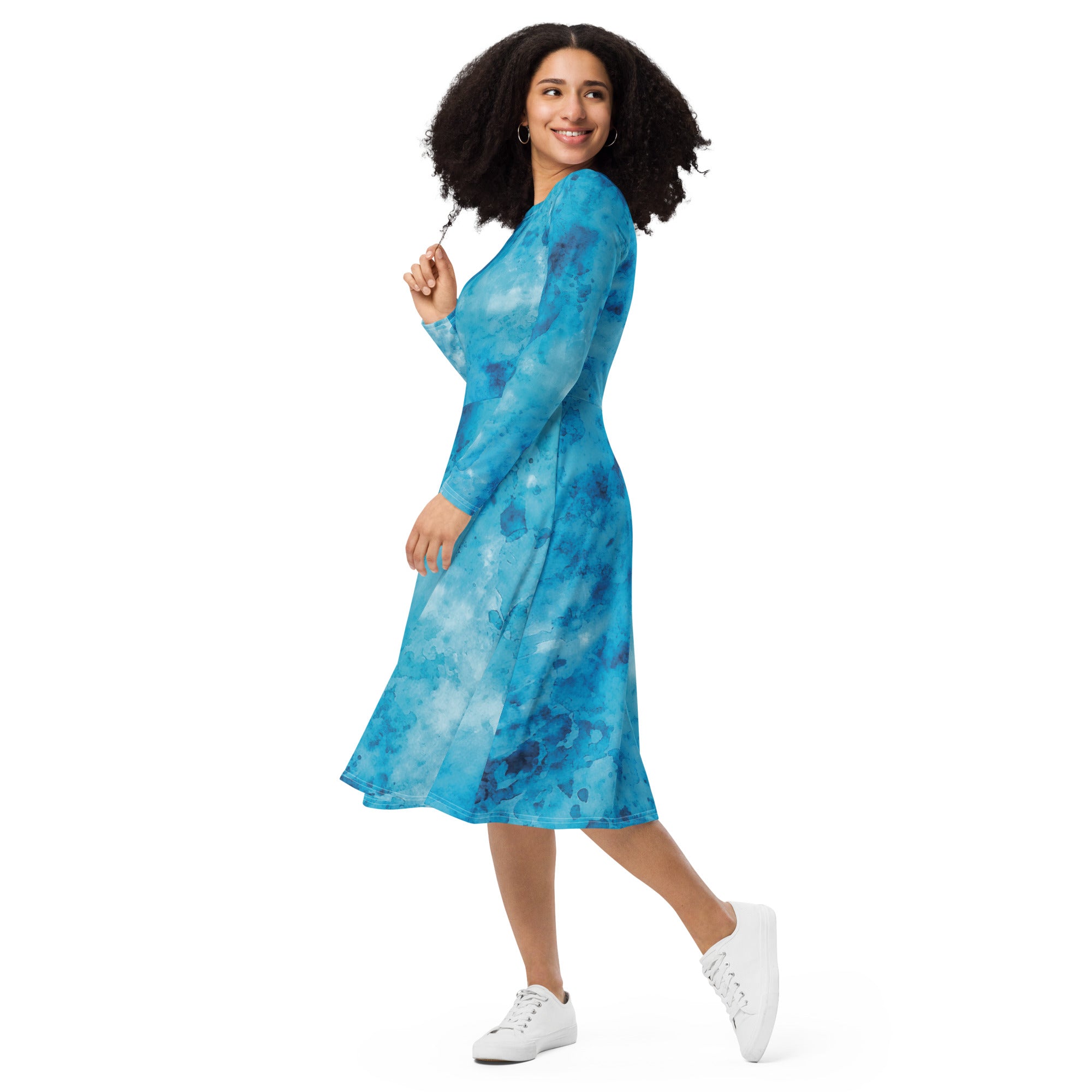 Womens Long Sleeve Midi Dress featuring a blue marble print, showcasing a fitted waist, flared bottom, and side pockets.