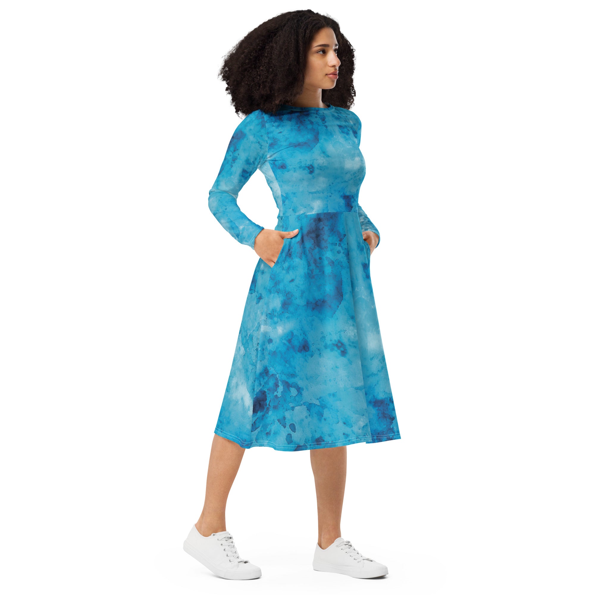 Womens Long Sleeve Midi Dress featuring a blue marble print, showcasing a fitted waist, flared bottom, and side pockets.