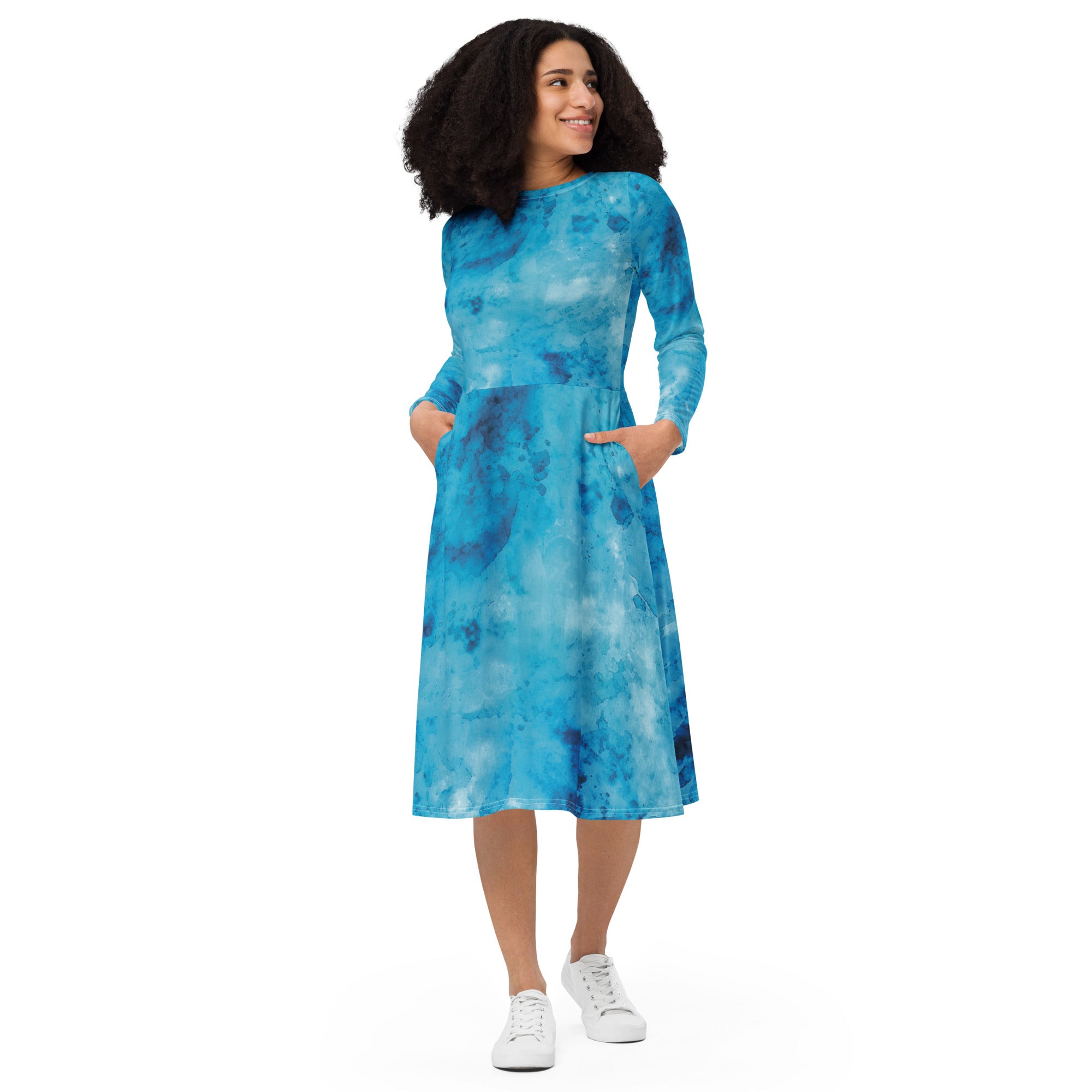 Womens Long Sleeve Midi Dress featuring a blue marble print, showcasing a fitted waist, flared bottom, and side pockets.