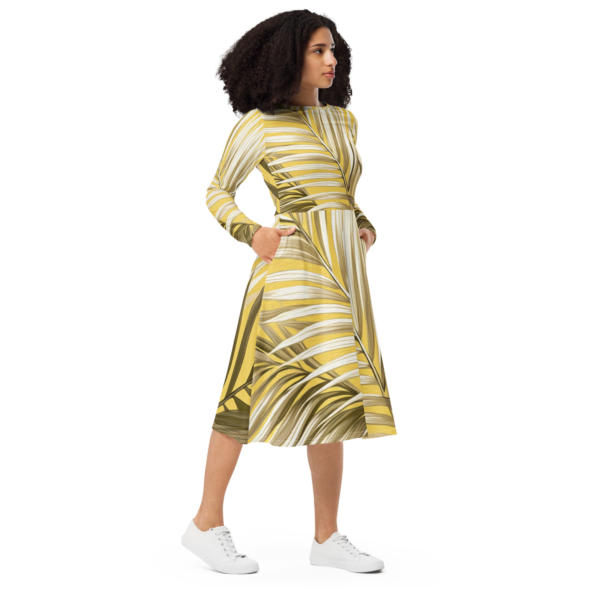 Womens Long Sleeve Midi Dress featuring a white and brown palm leaves design, showcasing its fitted waist, flared bottom, and long sleeves.