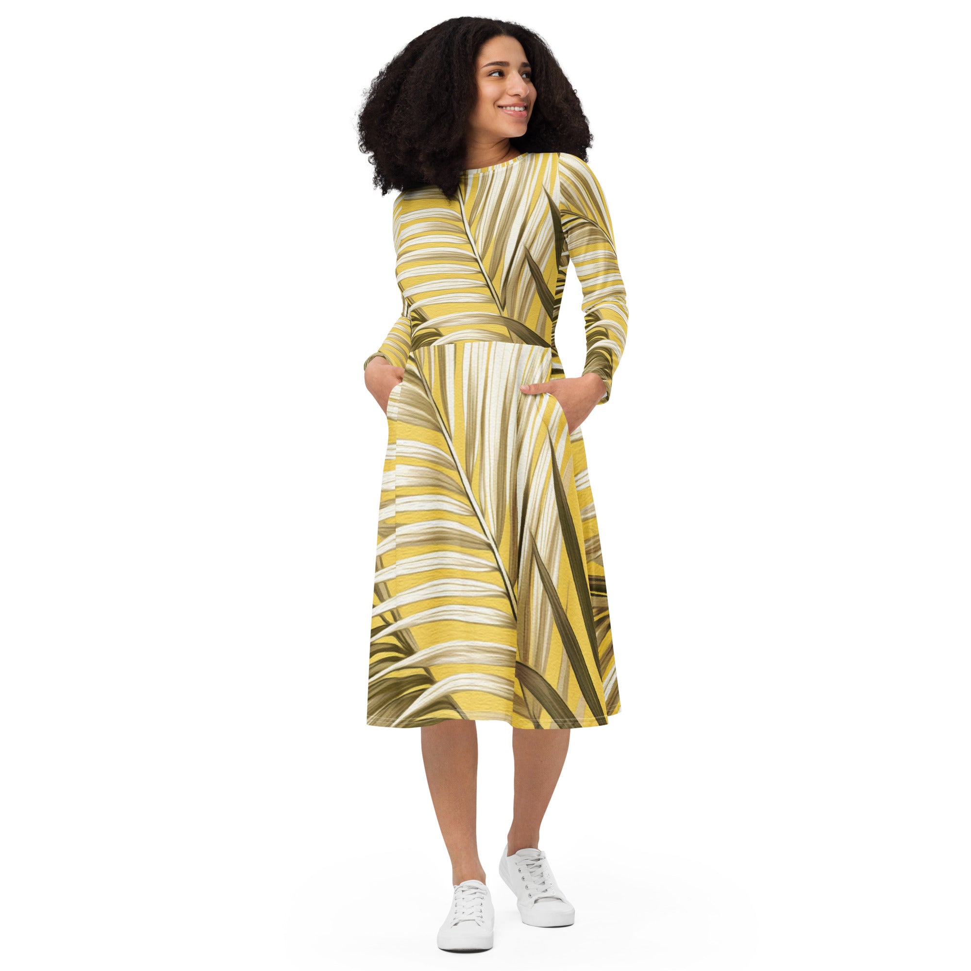 Womens Long Sleeve Midi Dress featuring a white and brown palm leaves design, showcasing its fitted waist, flared bottom, and long sleeves.