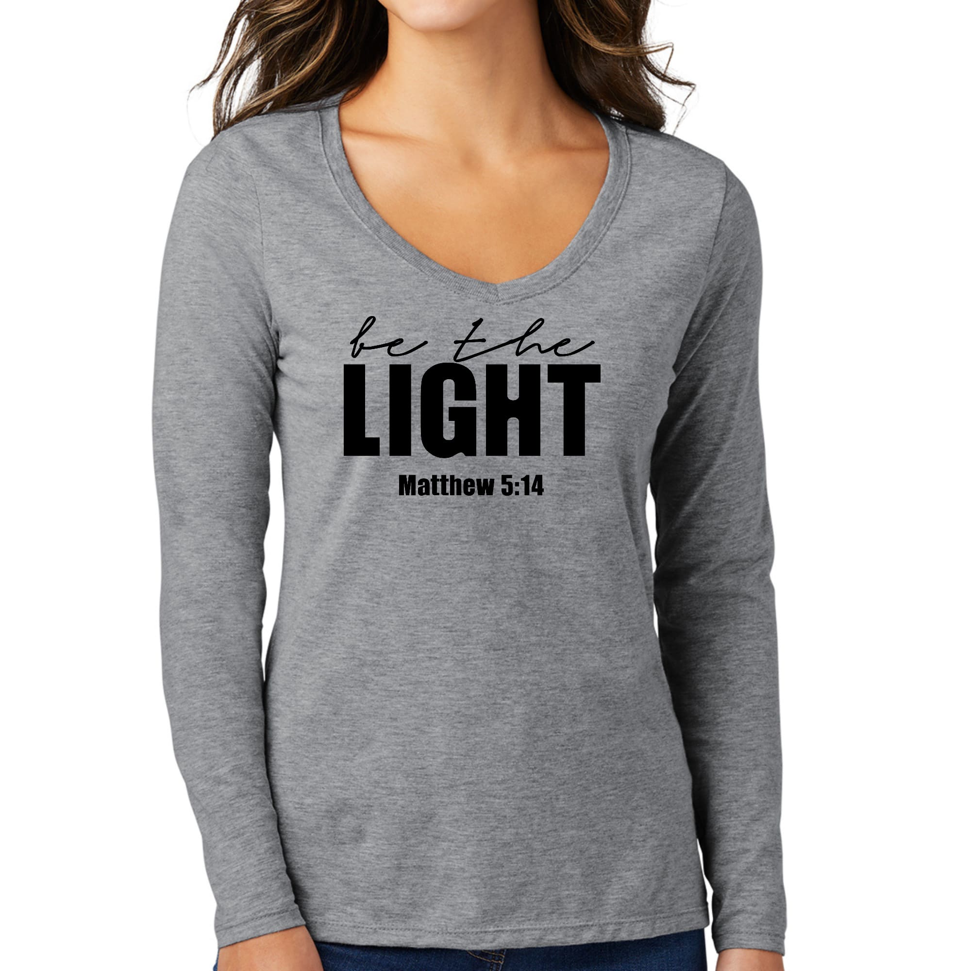 Womens Long Sleeve V-neck Graphic T-shirt in black with 'Be the Light' inspirational design, showcasing a stylish and comfortable fit.