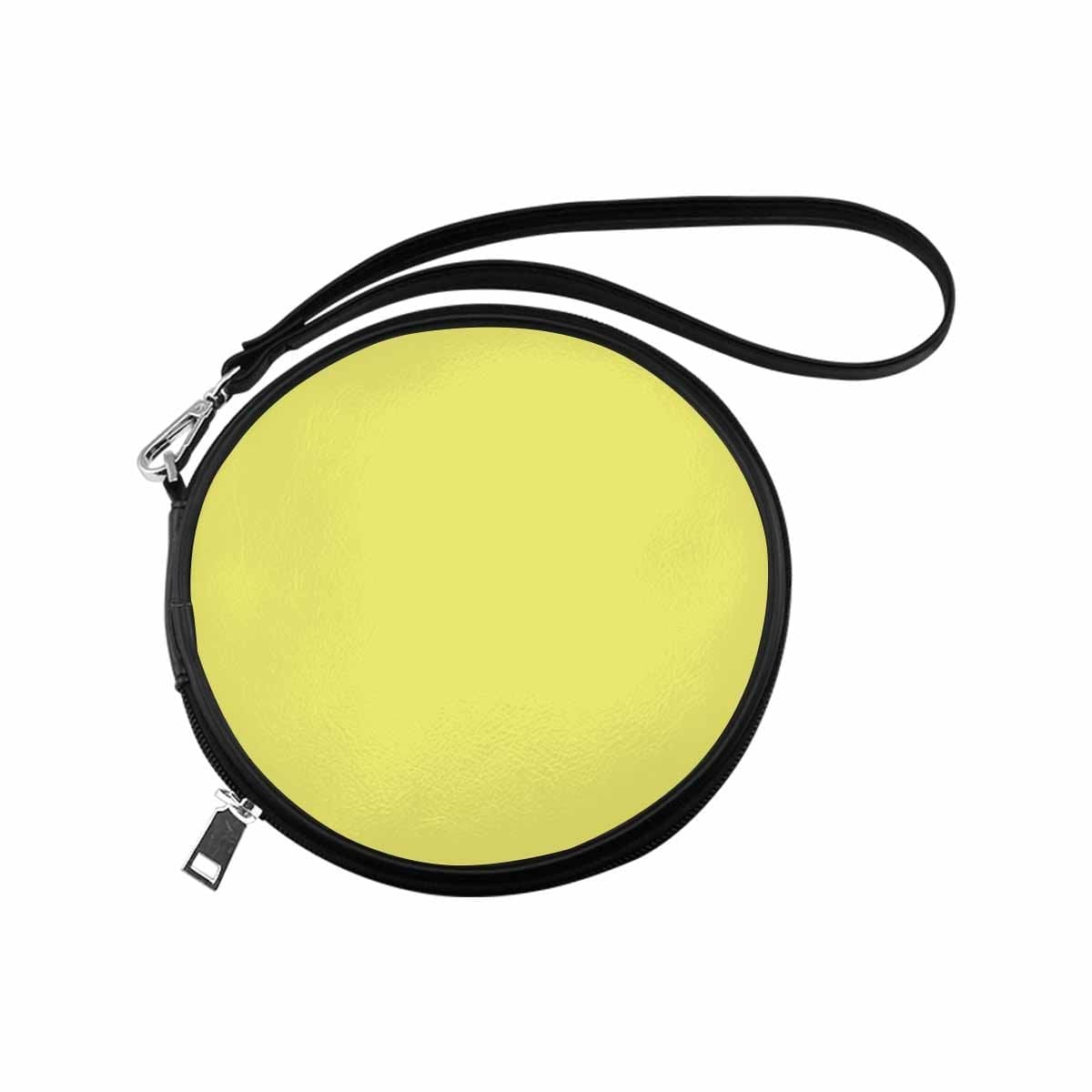 Womens Round Handbag in Honeysuckle Yellow made of high-grade PU leather with a wristlet strap.