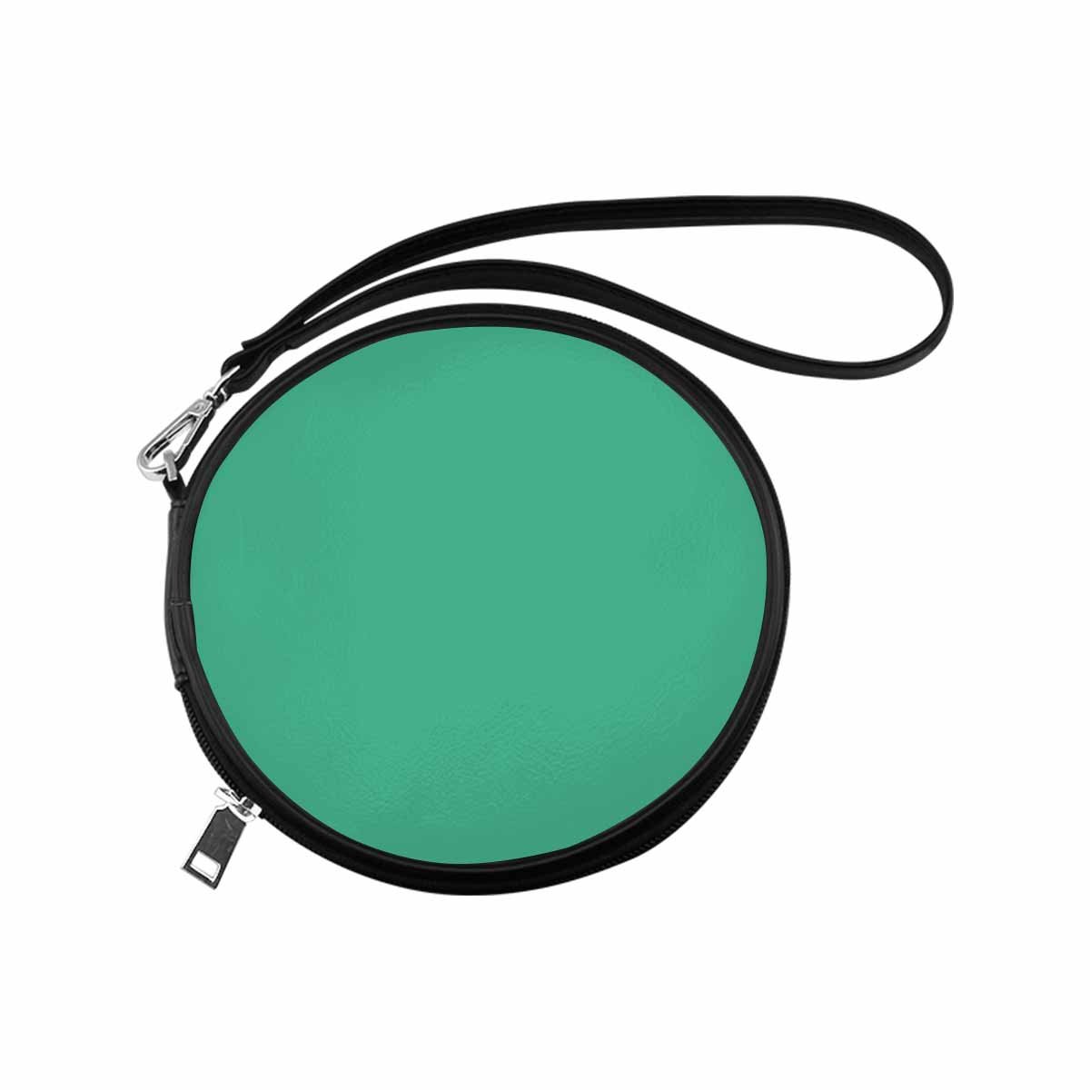 Womens Round Handbag in Spearmint Green made of high-grade PU leather with a wristlet strap.