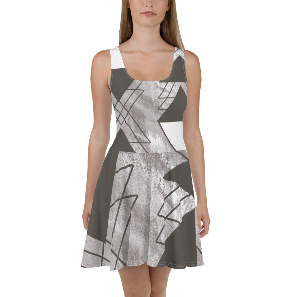 Women's skater dress in ash grey and white triangular colorblock, featuring a flattering A-line silhouette and sleeveless design.