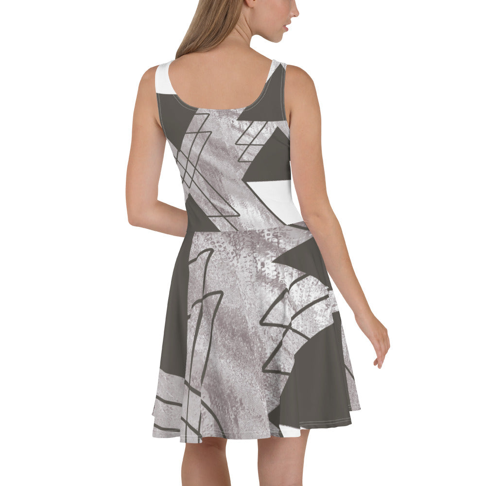 Women's skater dress in ash grey and white triangular colorblock, featuring a flattering A-line silhouette and sleeveless design.