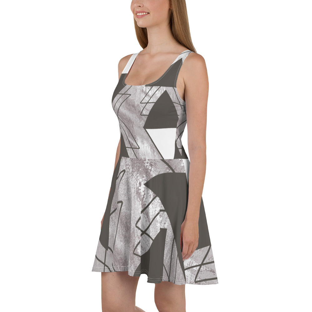 Women's skater dress in ash grey and white triangular colorblock, featuring a flattering A-line silhouette and sleeveless design.