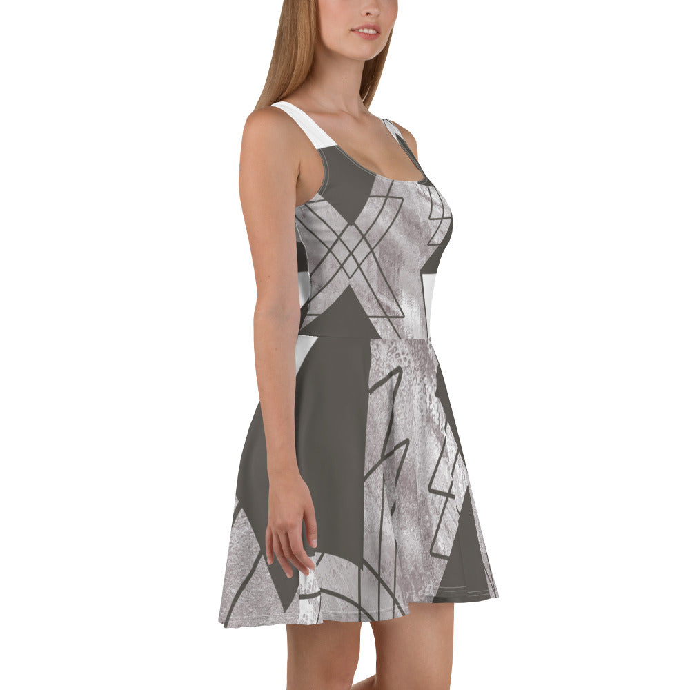 Women's skater dress in ash grey and white triangular colorblock, featuring a flattering A-line silhouette and sleeveless design.