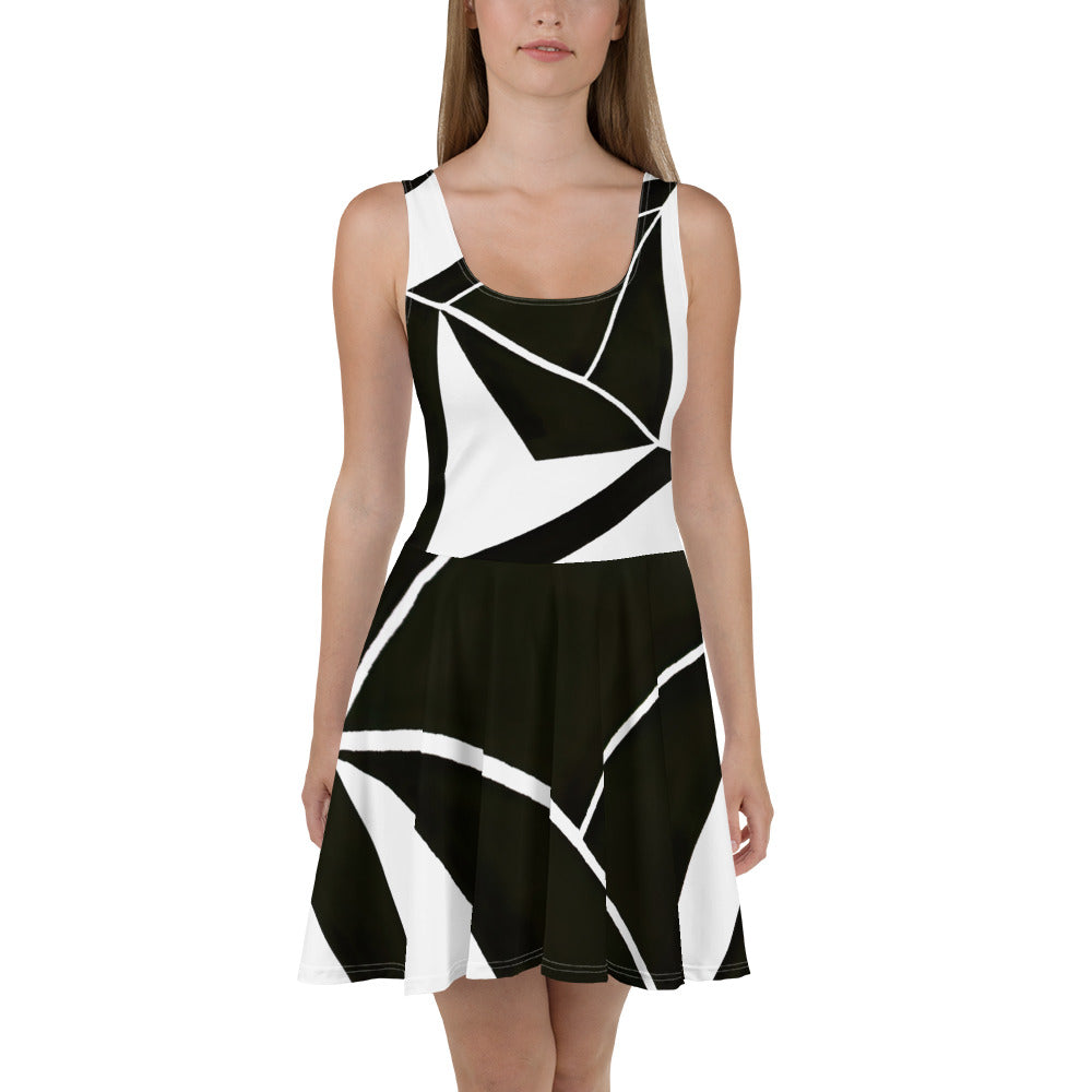 Women's skater dress featuring a black and white geometric pattern, showcasing a flattering A-line silhouette and sleeveless design.