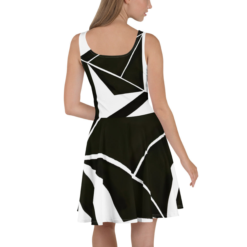 Women's skater dress featuring a black and white geometric pattern, showcasing a flattering A-line silhouette and sleeveless design.