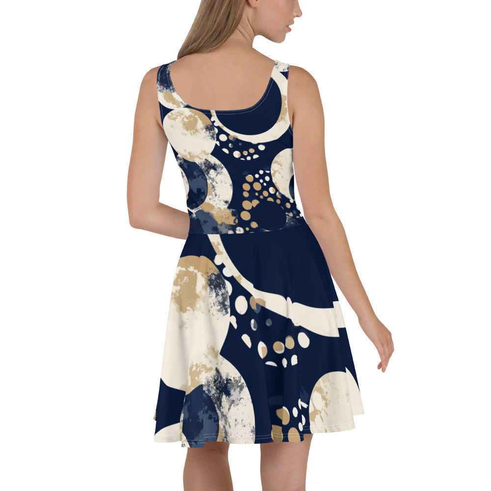 Women's skater dress featuring a blue and beige spotted print, with a flattering A-line silhouette and sleeveless design.