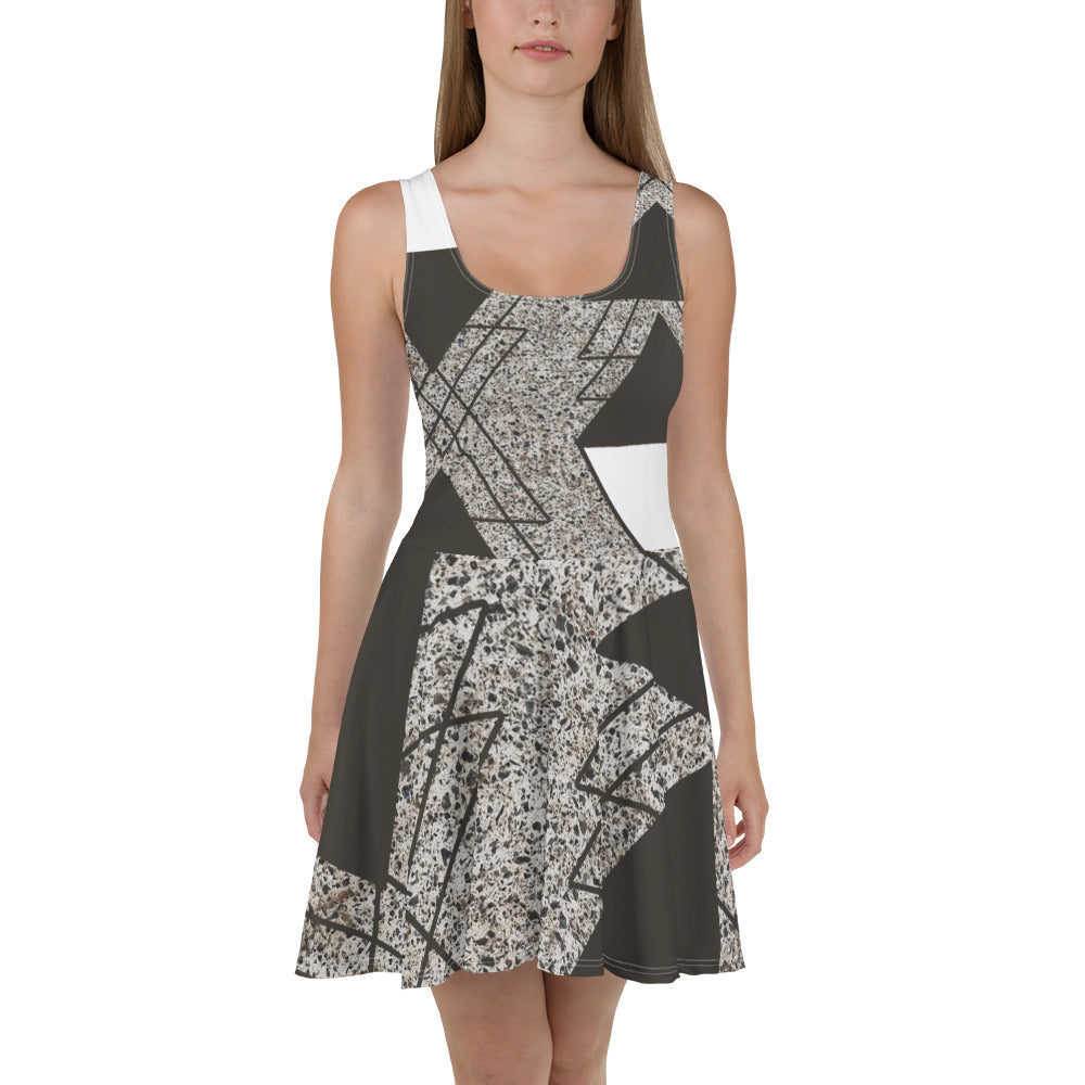 Women's skater dress featuring a brown and white triangular colorblock design, showcasing a flattering A-line silhouette and sleeveless style.