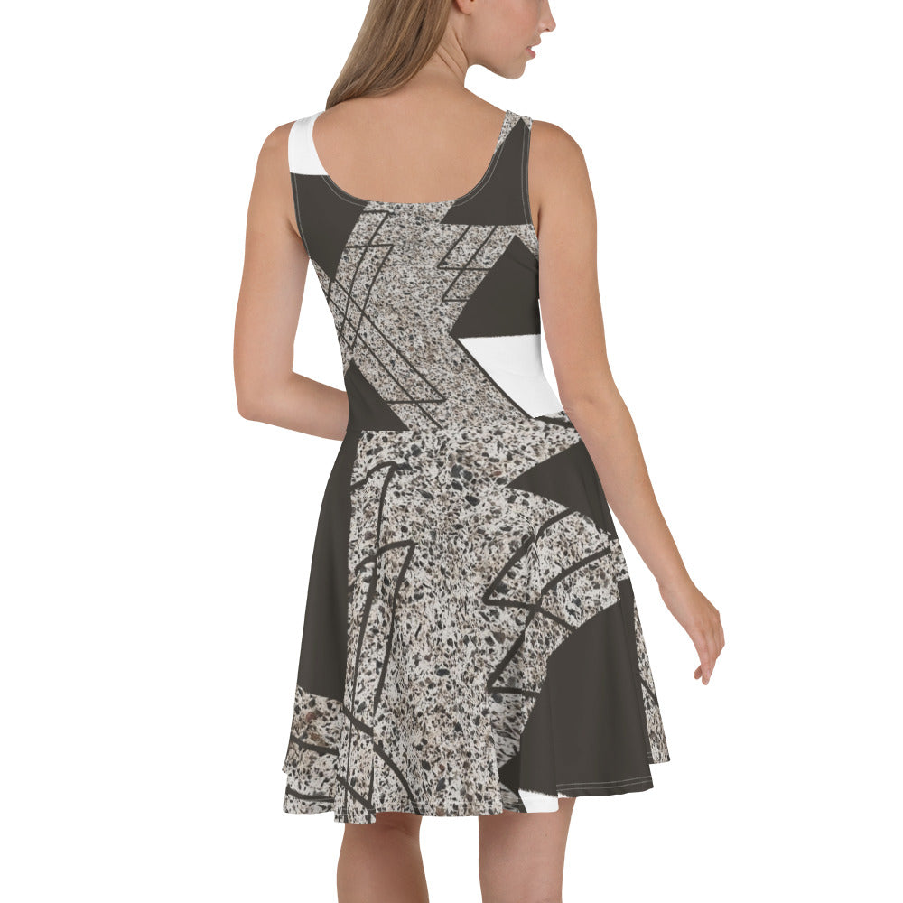 Women's skater dress featuring a brown and white triangular colorblock design, showcasing a flattering A-line silhouette and sleeveless style.